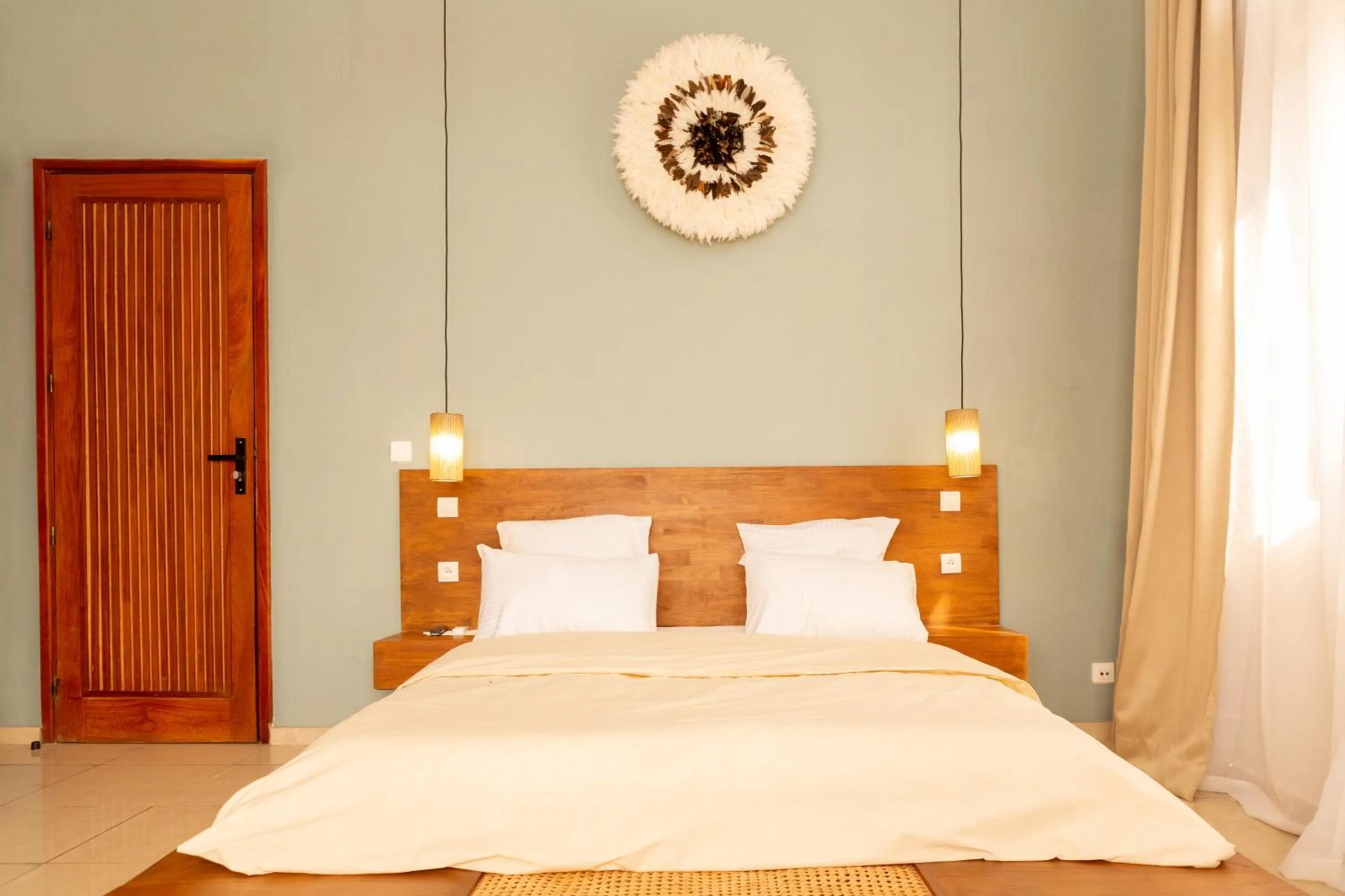 Bed in Tamarin Hôtel Cotonou