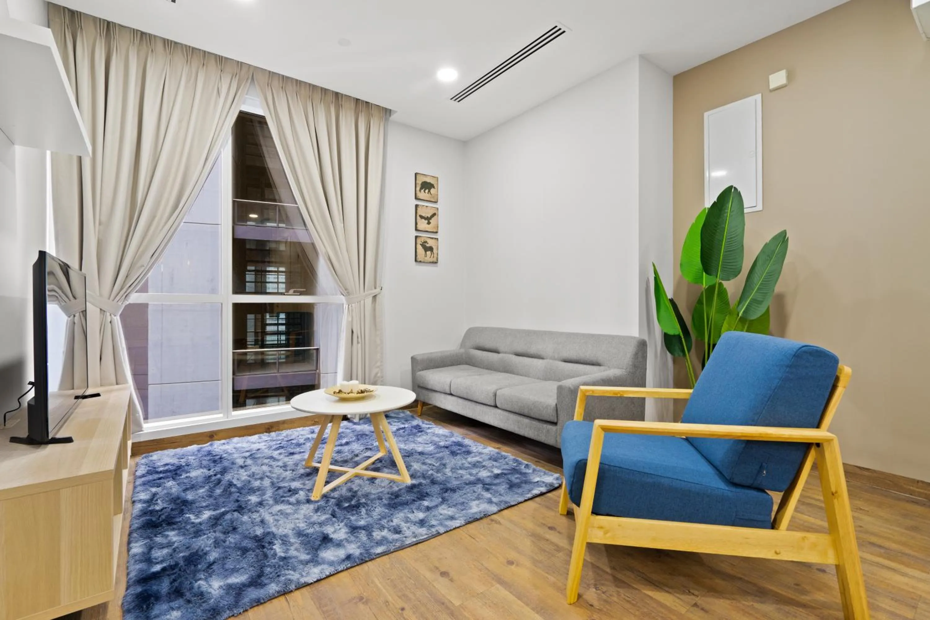 Living room in Binjai 8 by Plush