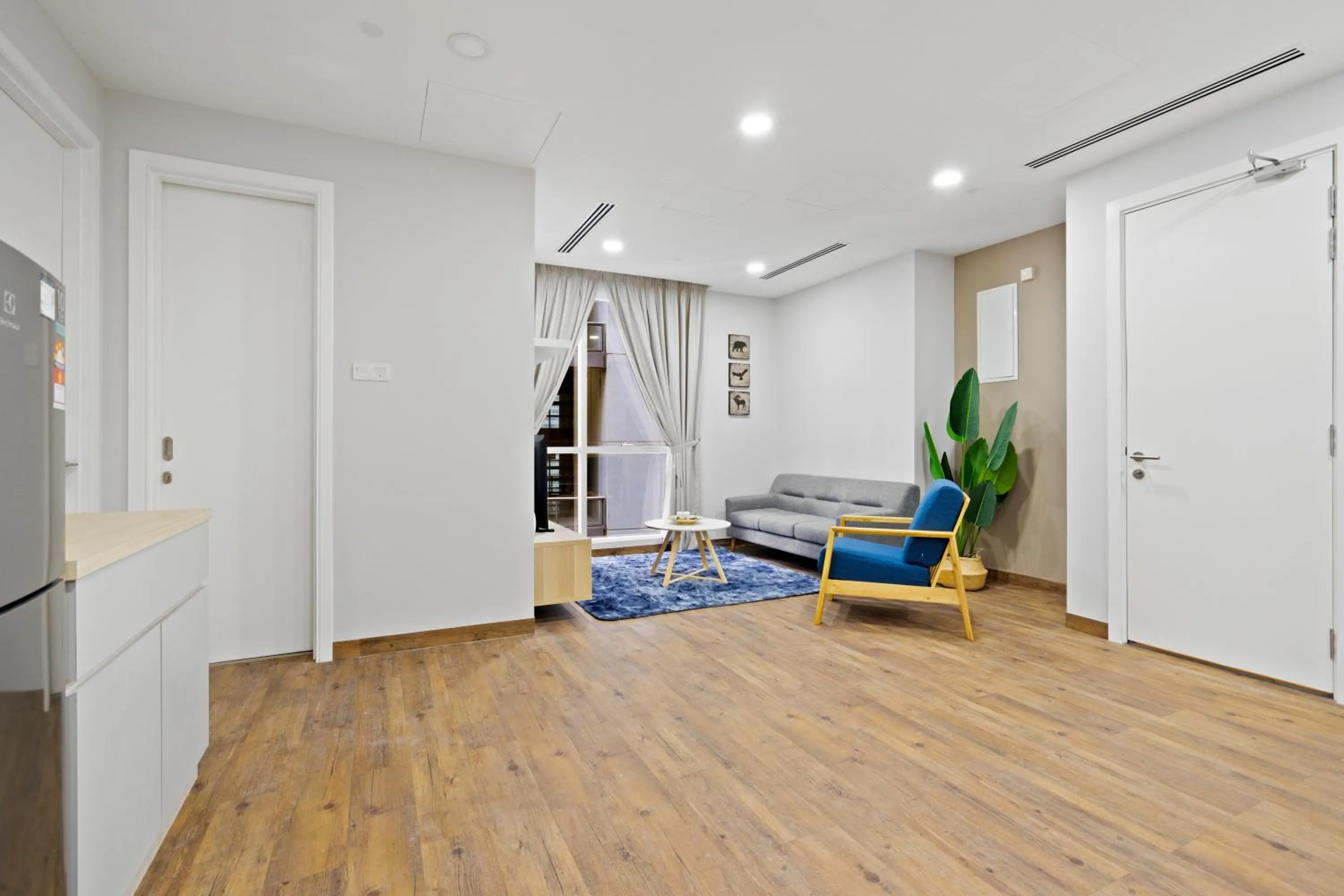 Living room in Binjai 8 by Plush