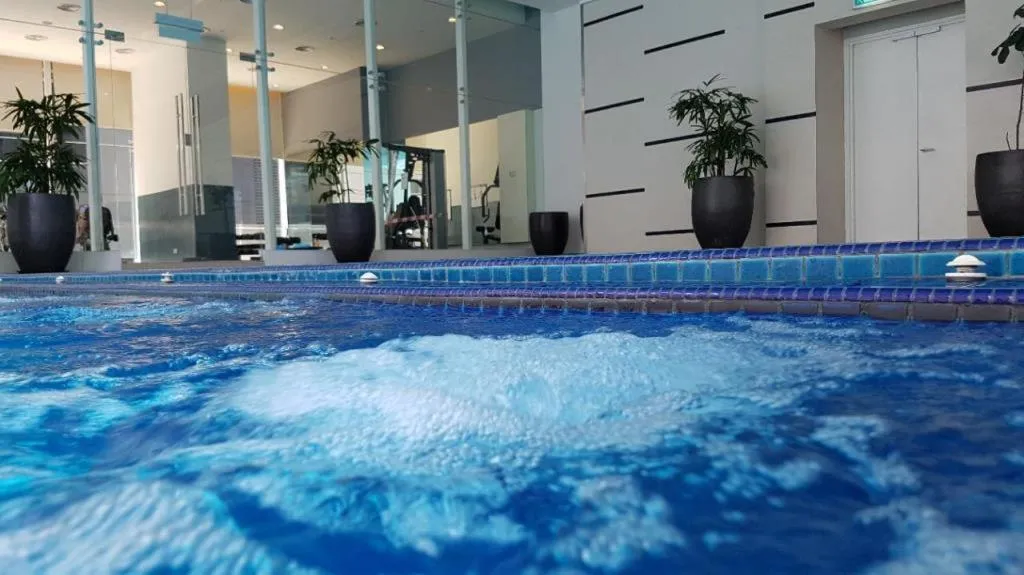 Swimming pool in Binjai 8 by Plush