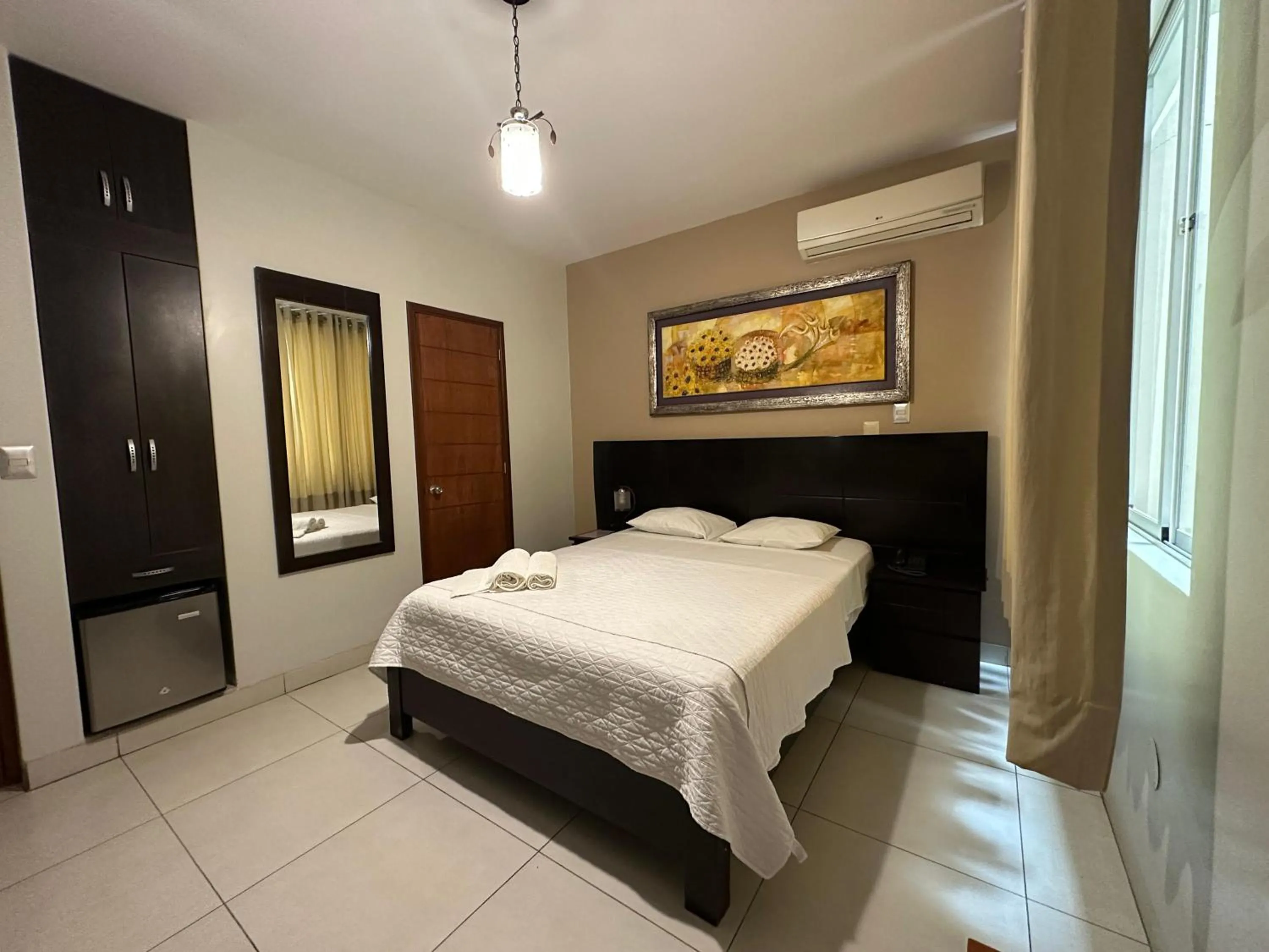 Bed in Cacique Hotel