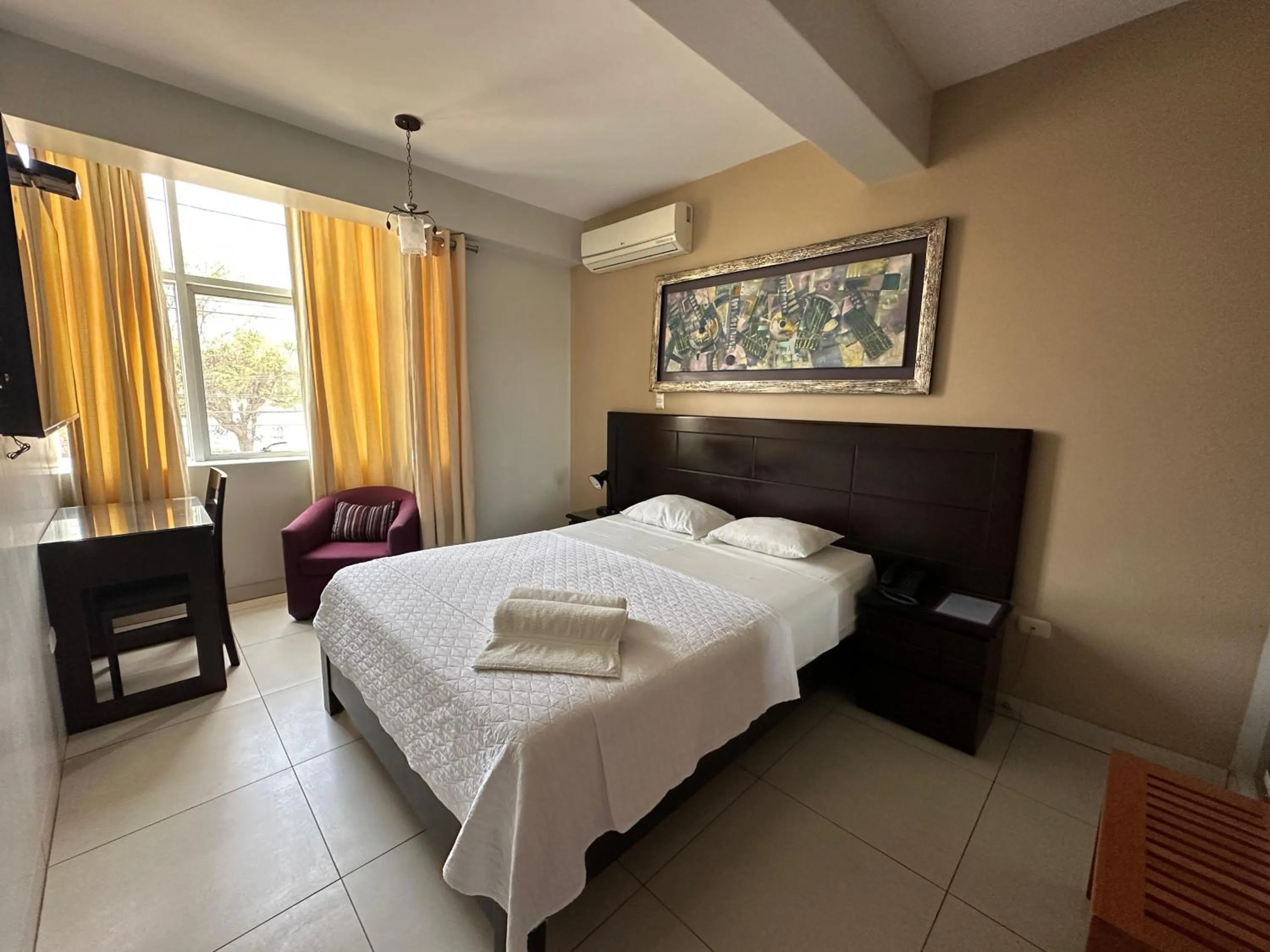 Bed in Cacique Hotel