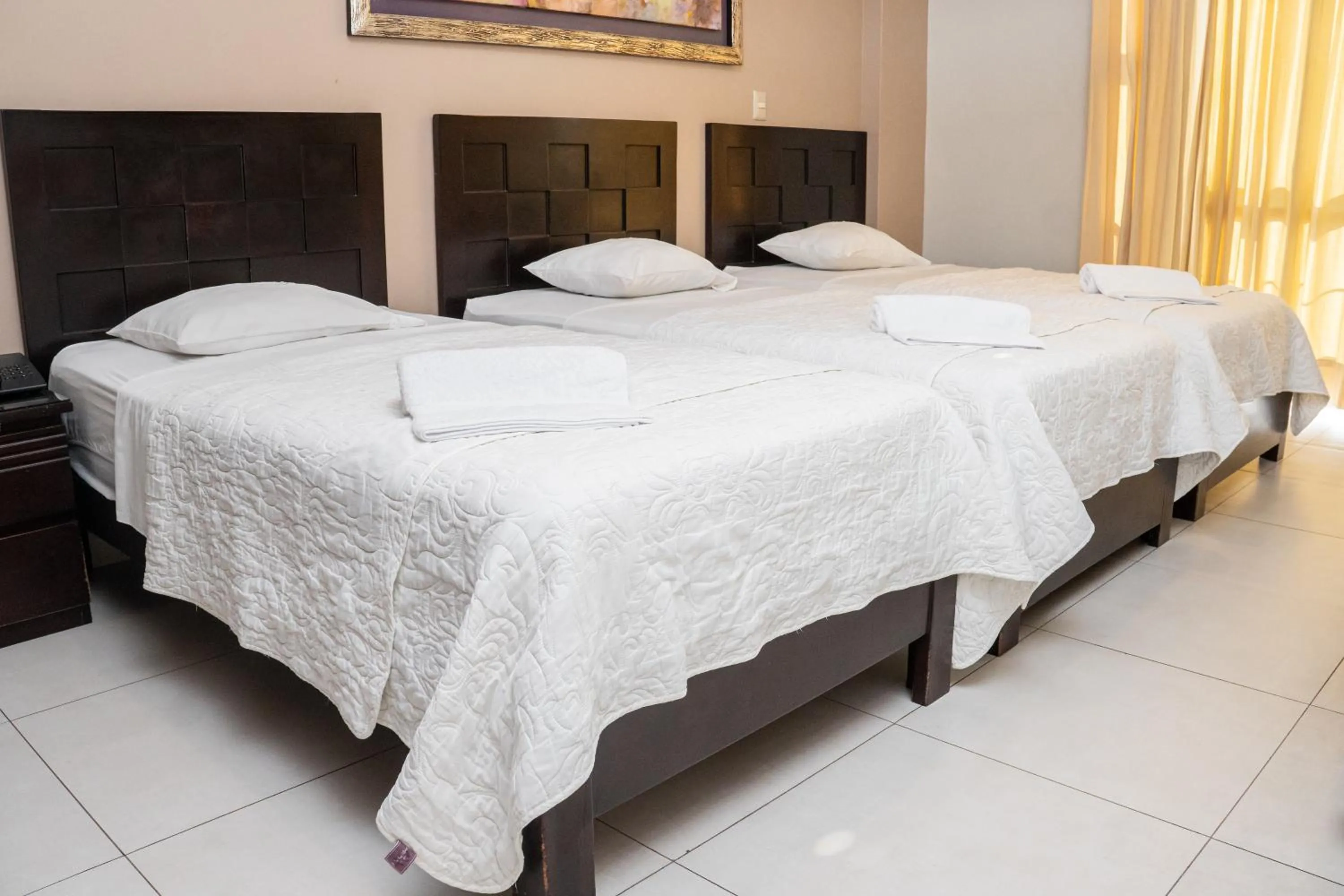 Bed in Cacique Hotel