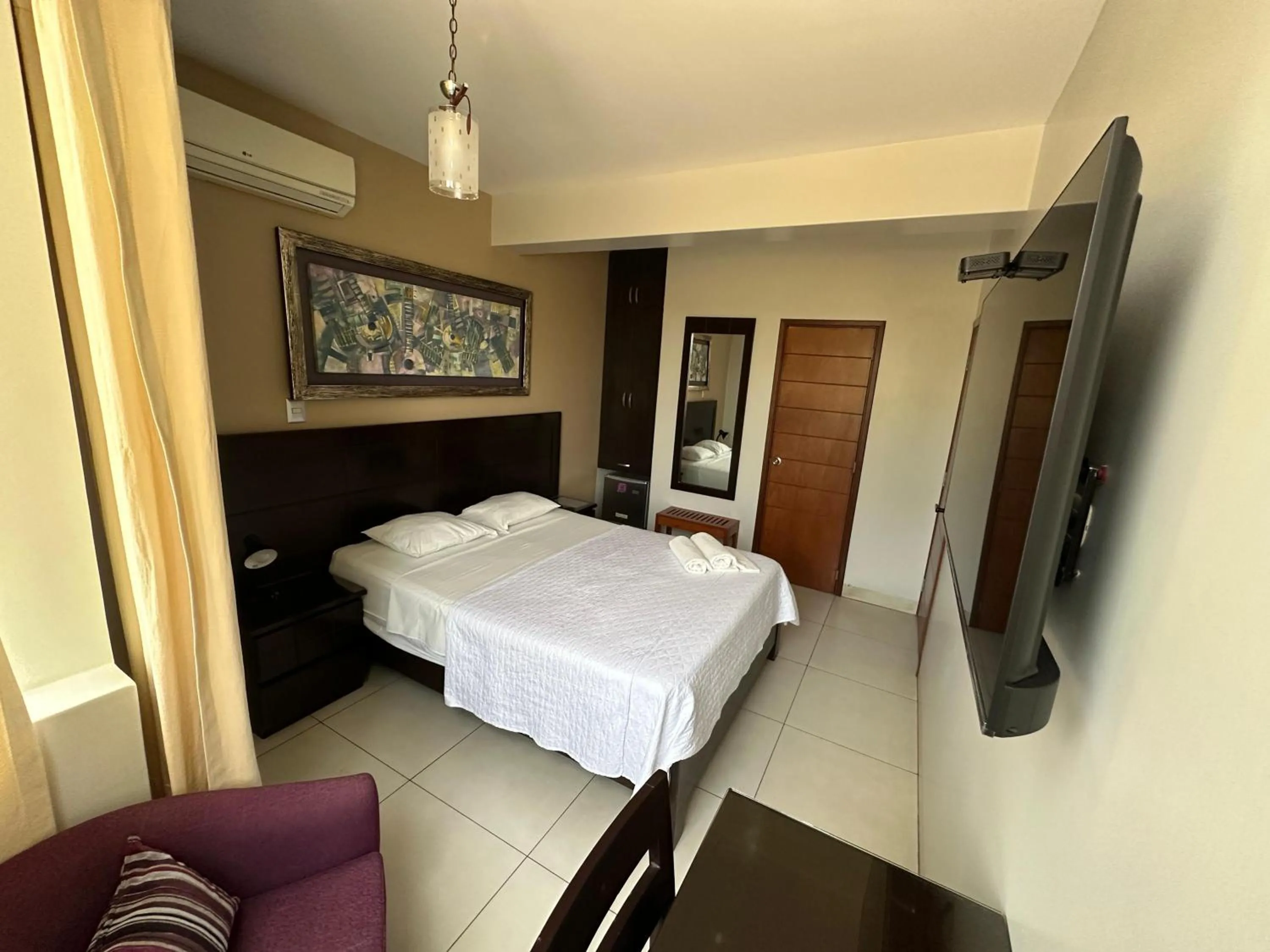 Bed in Cacique Hotel