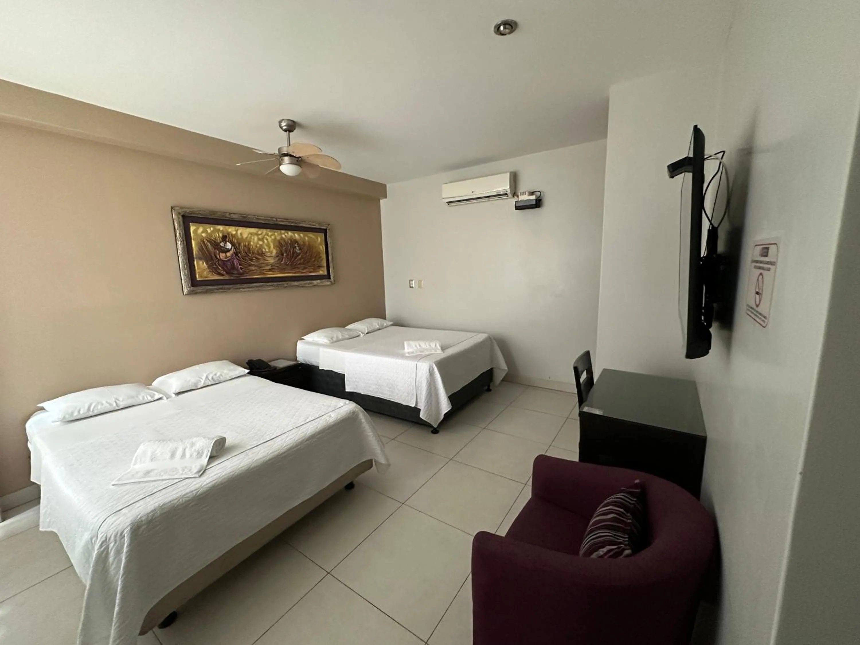 Bed in Cacique Hotel