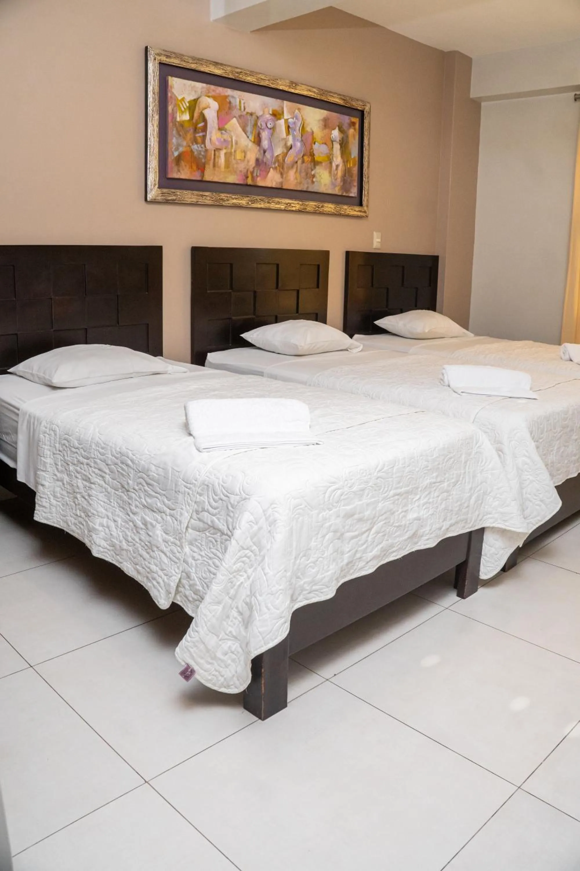 Bed in Cacique Hotel