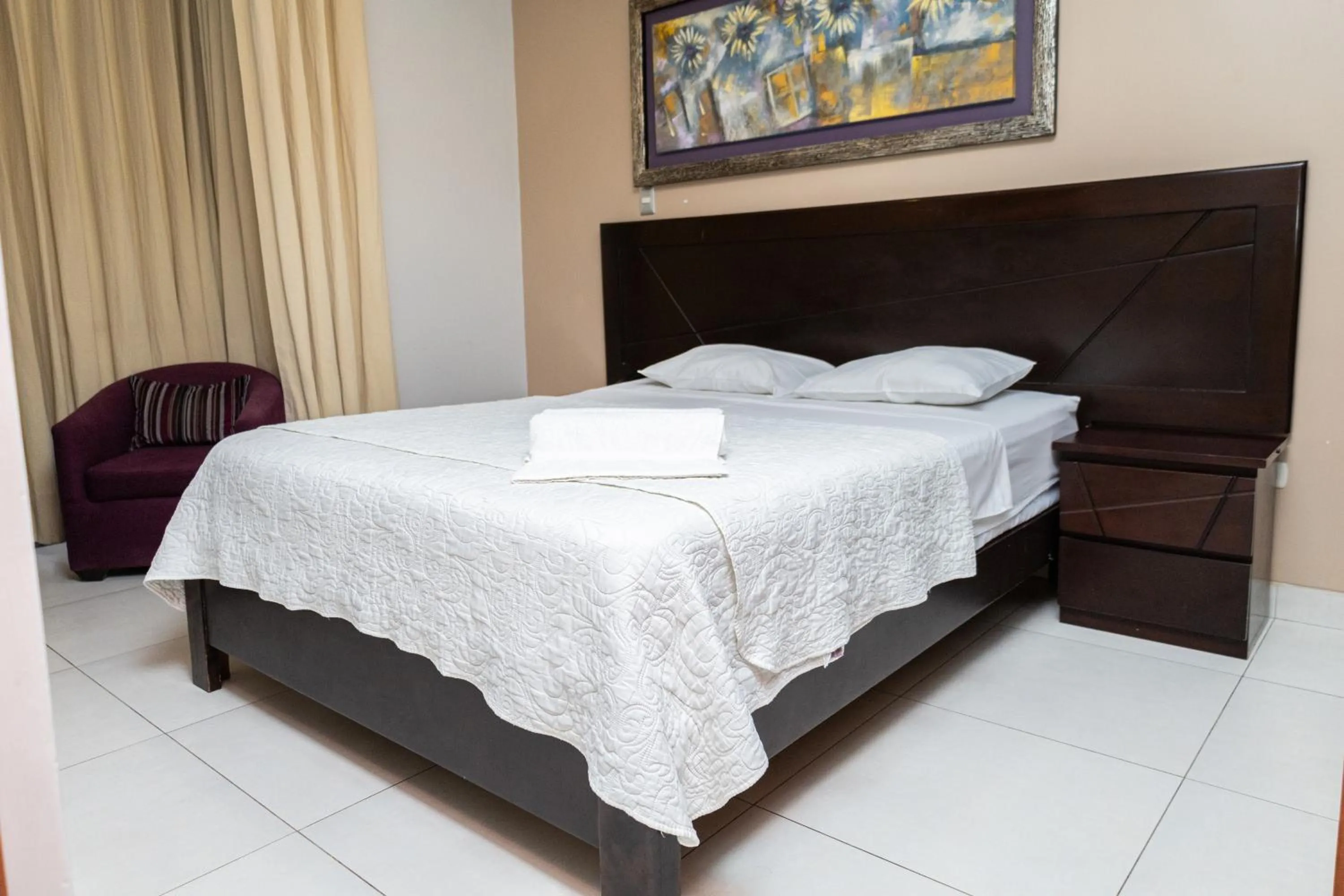 Bed in Cacique Hotel
