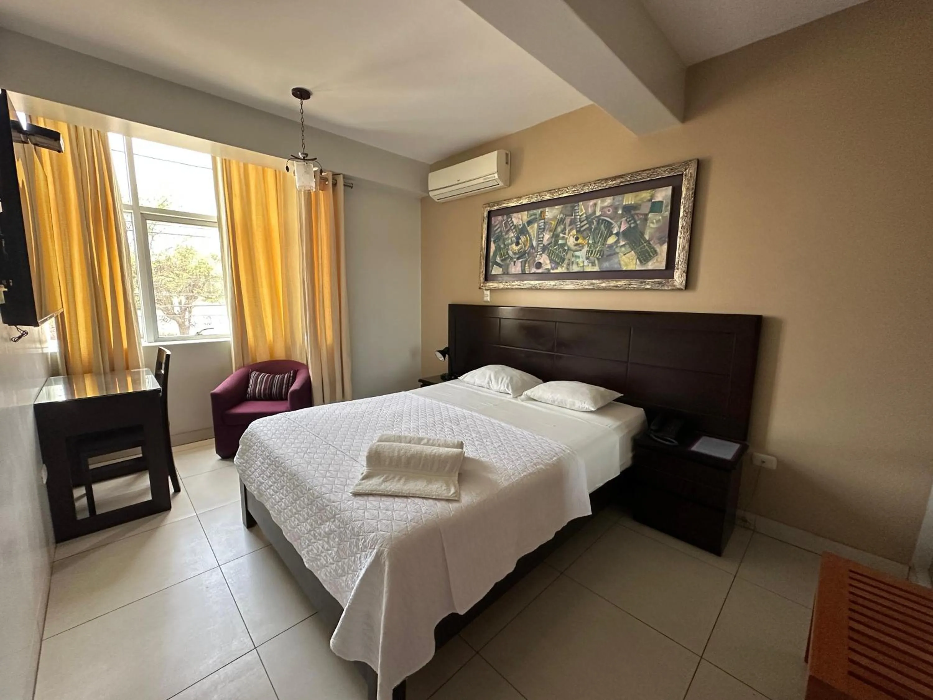 Bed in Cacique Hotel