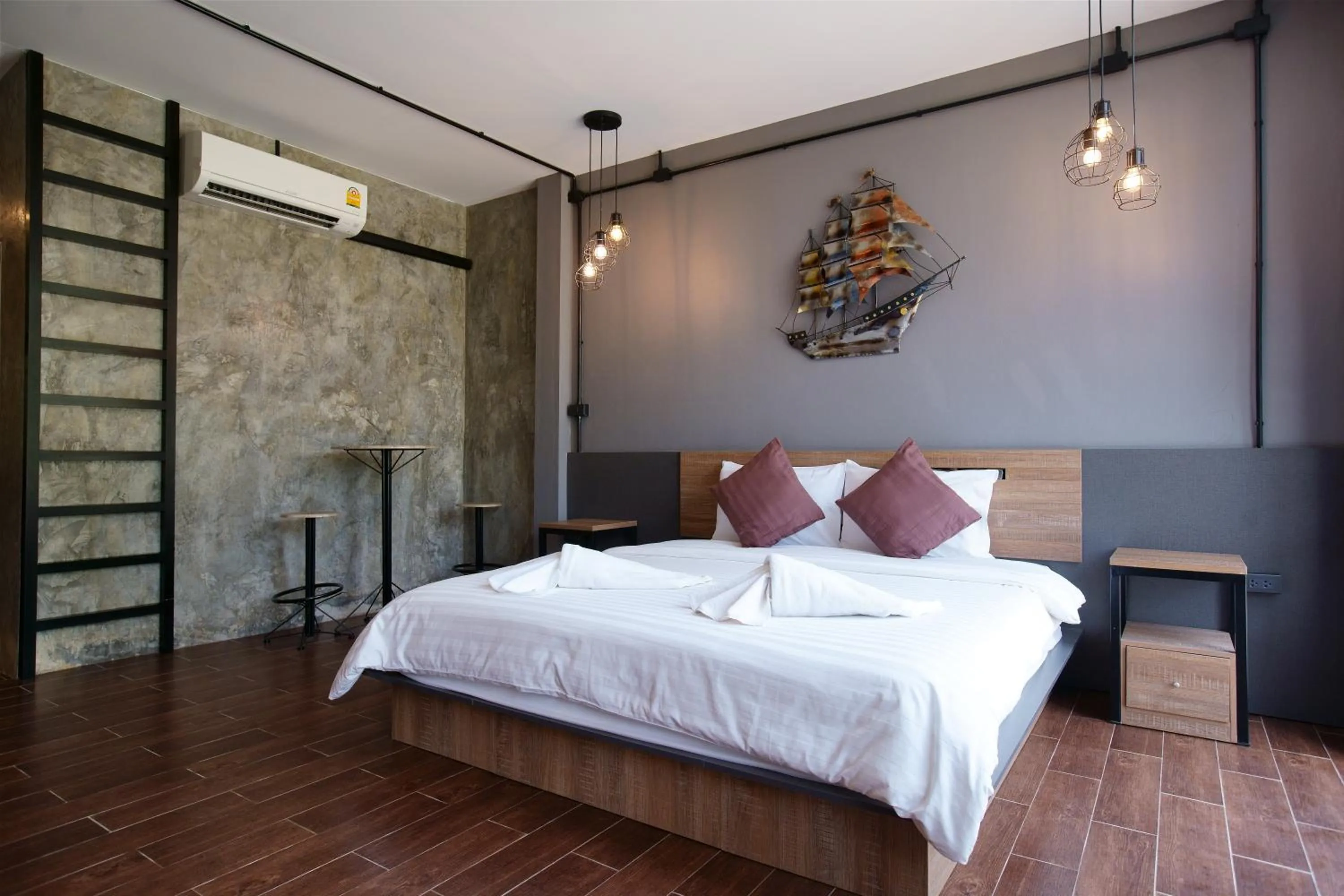 Bed in Kwai Tara Riverside Villas