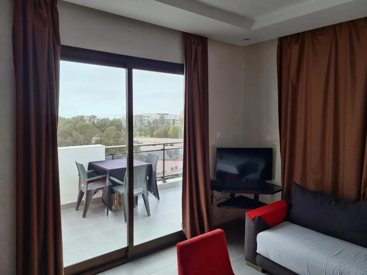 Communal lounge/ TV room in La Suite Hotel Agadir Adults Only