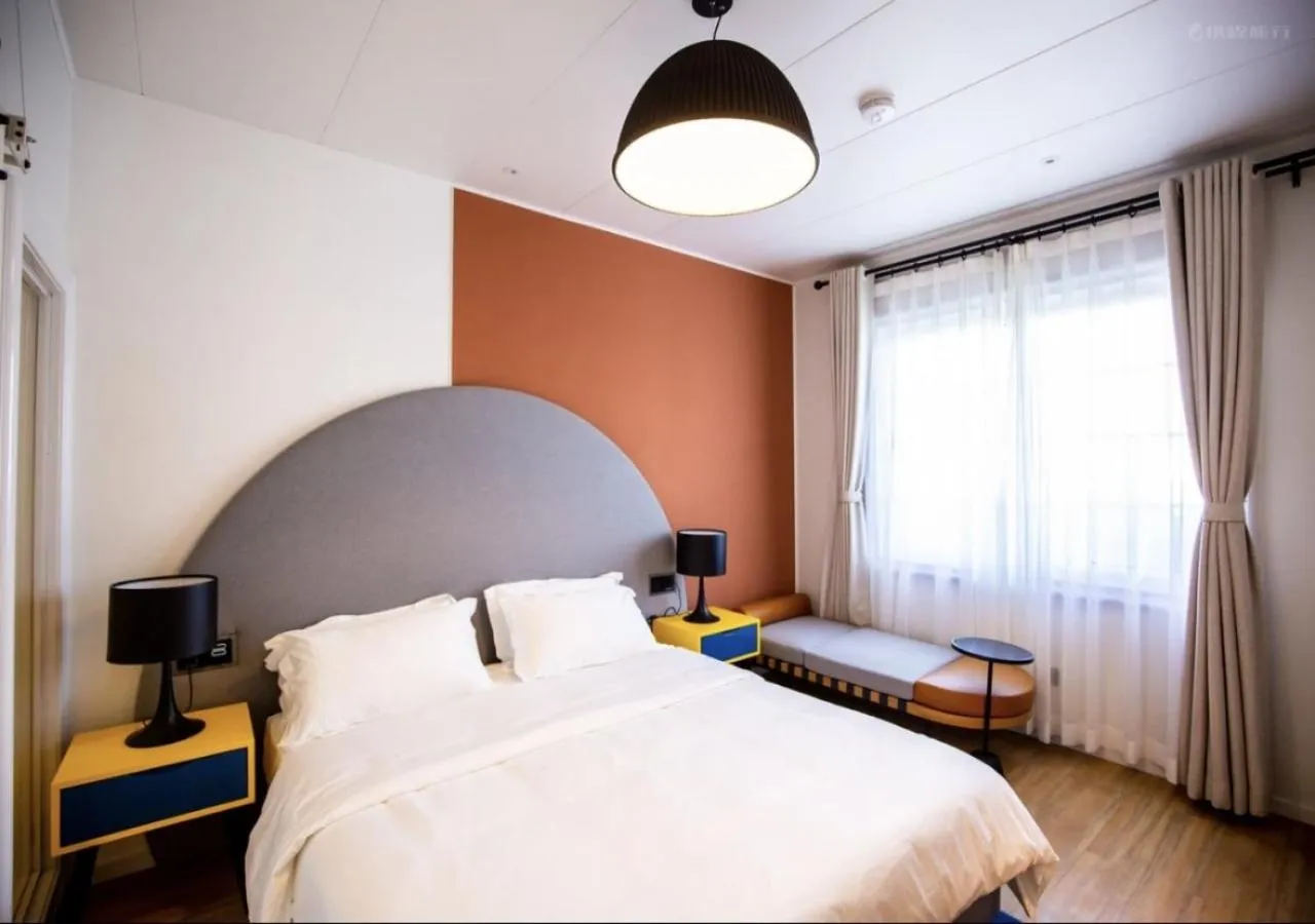 Bedroom, Bed in Discovery Saipan Hotel