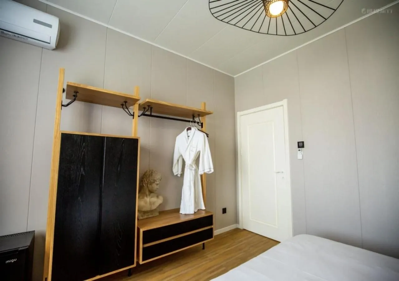 Bedroom, Bed in Discovery Saipan Hotel