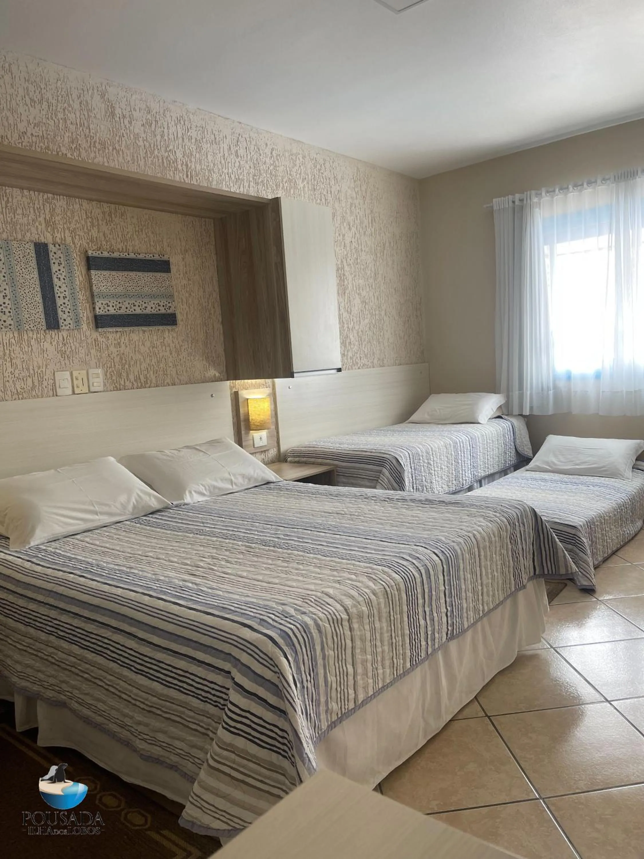 Bed in Pousada Ilha dos Lobos