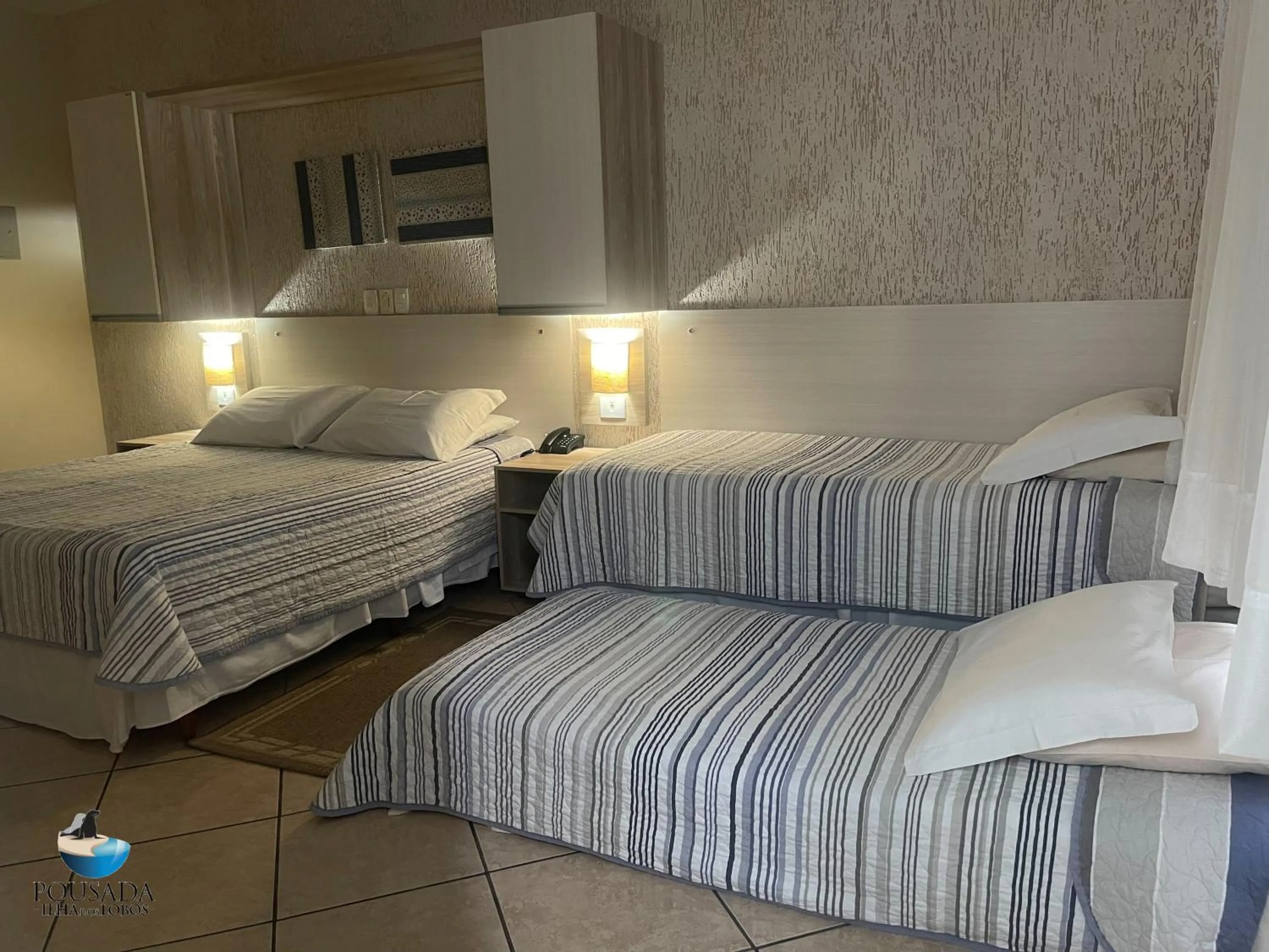 Bed in Pousada Ilha dos Lobos