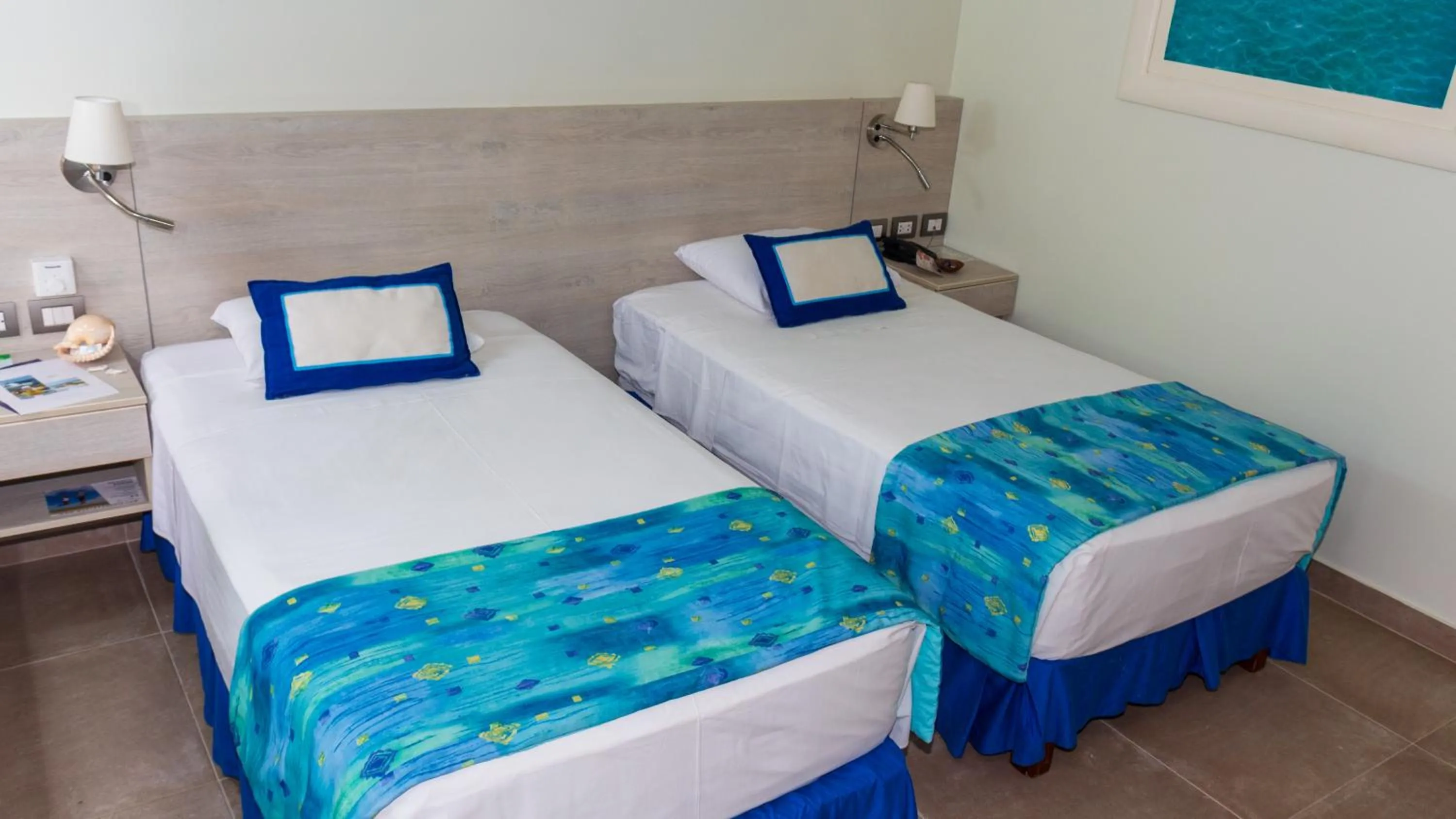 Bed in Punta Sal Suites & Bungalows Resort