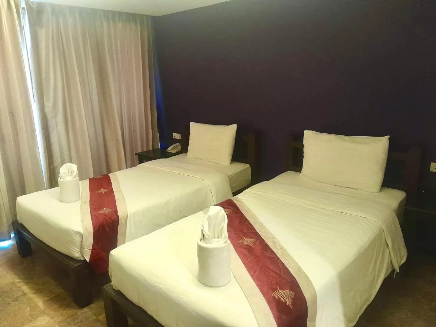 Bed in All Together Suite Hotel