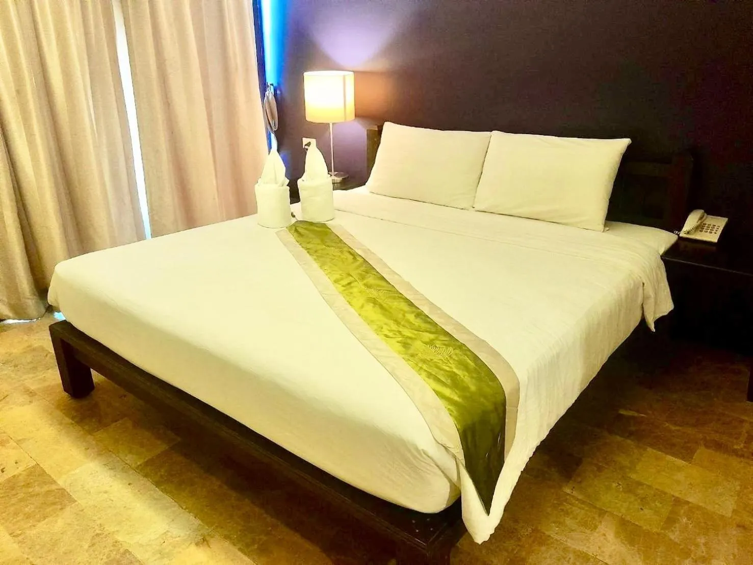 Bed in All Together Suite Hotel