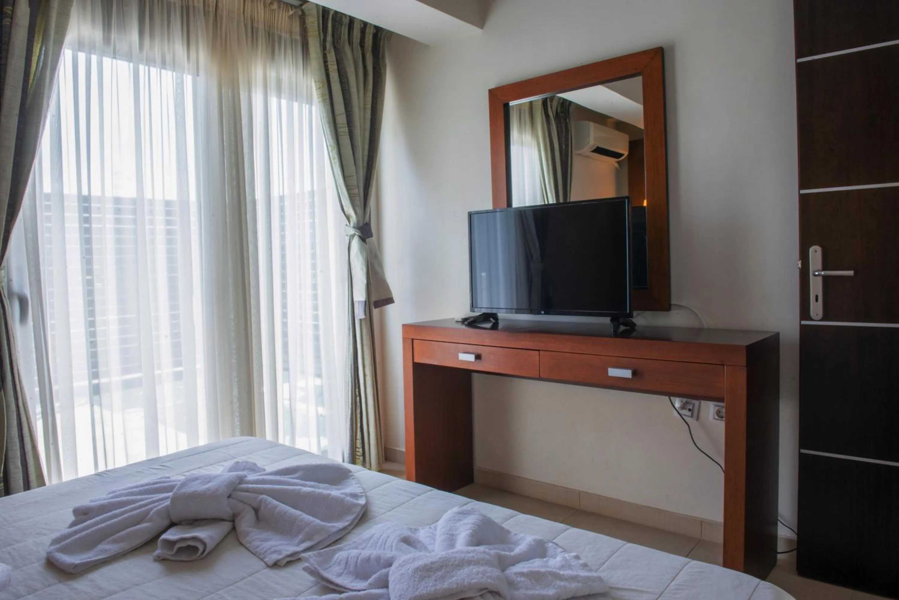 Bed in GOLDEN SUN Κokkoni Beach Hotel