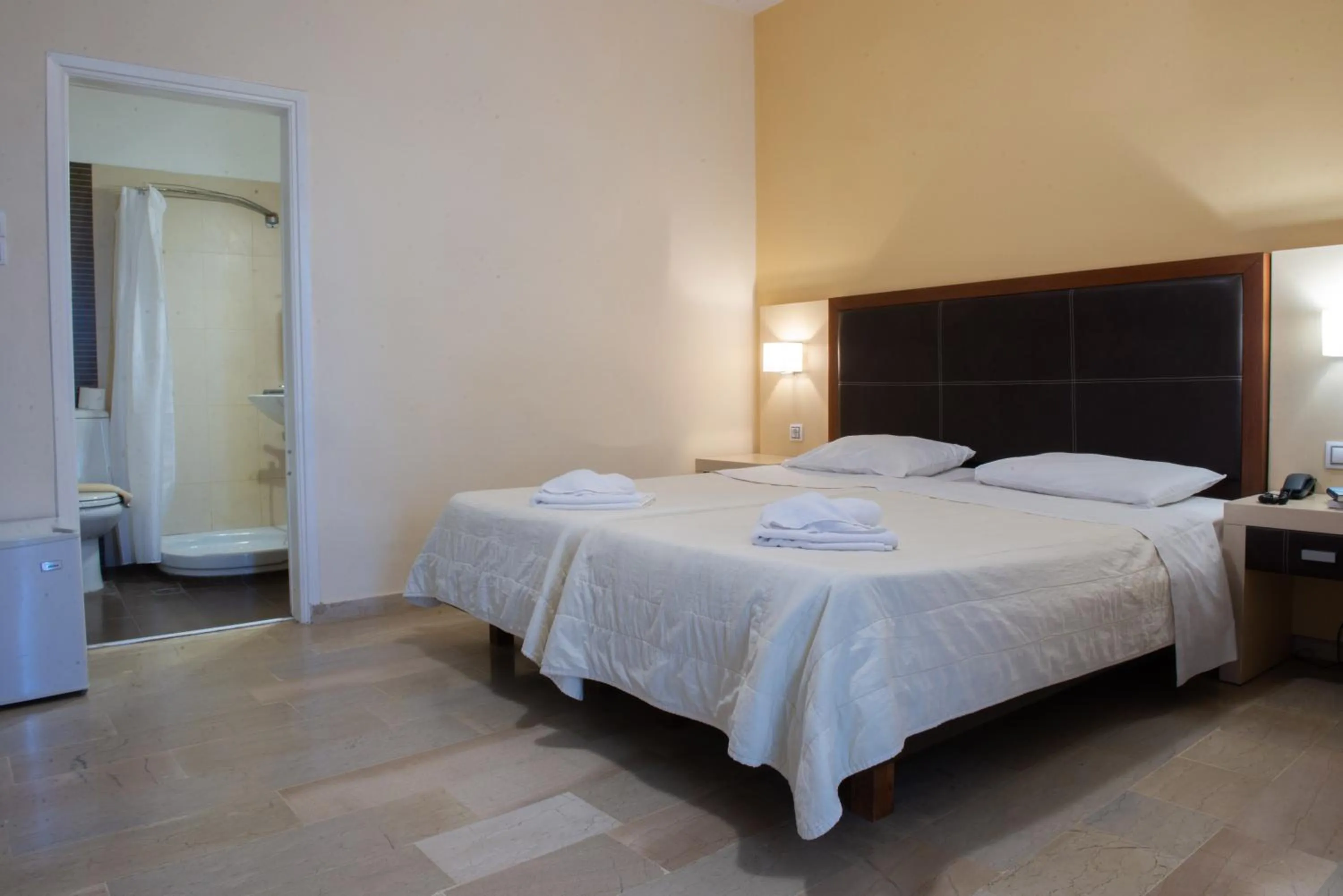 Bed in GOLDEN SUN Κokkoni Beach Hotel