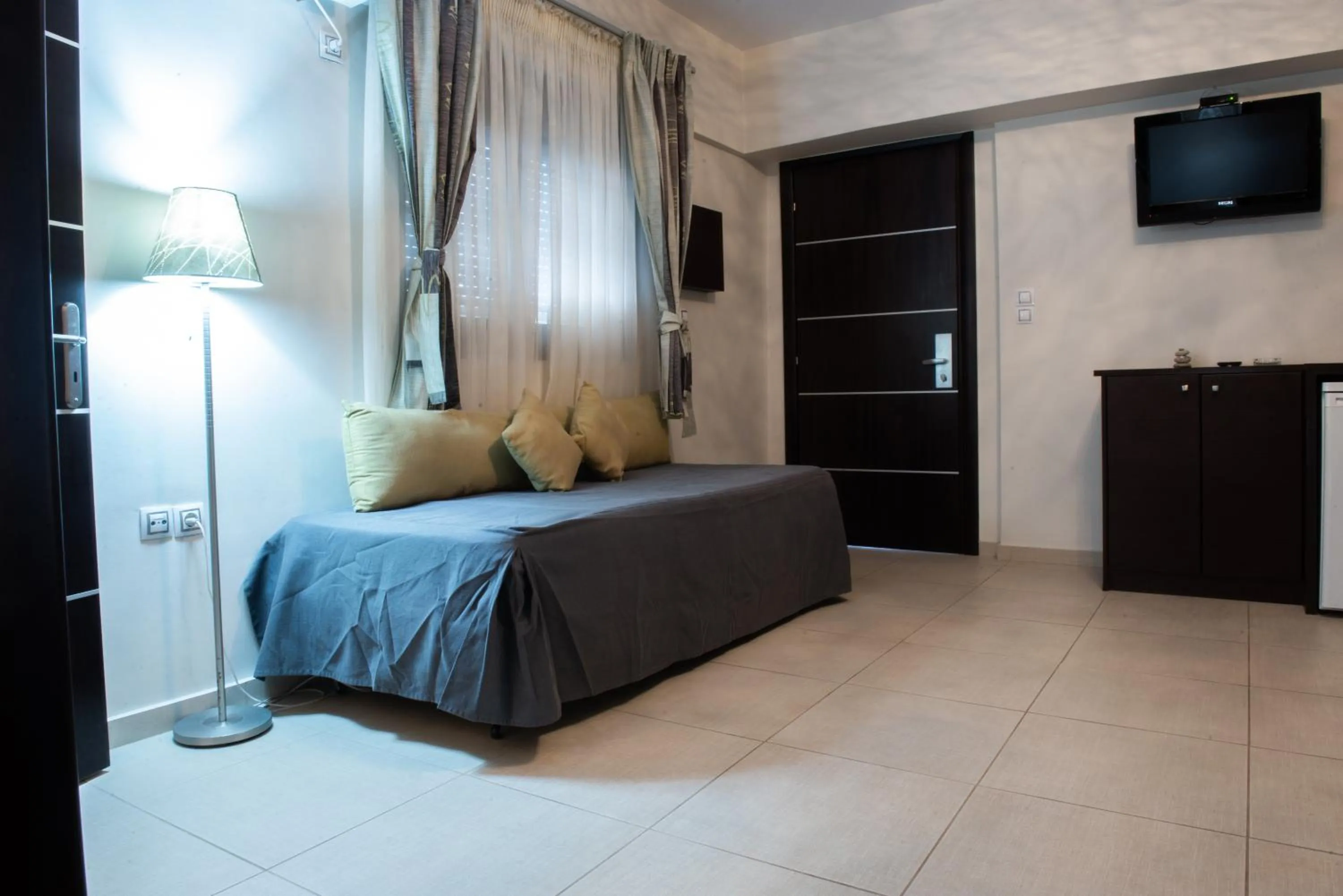 Bed in GOLDEN SUN Κokkoni Beach Hotel