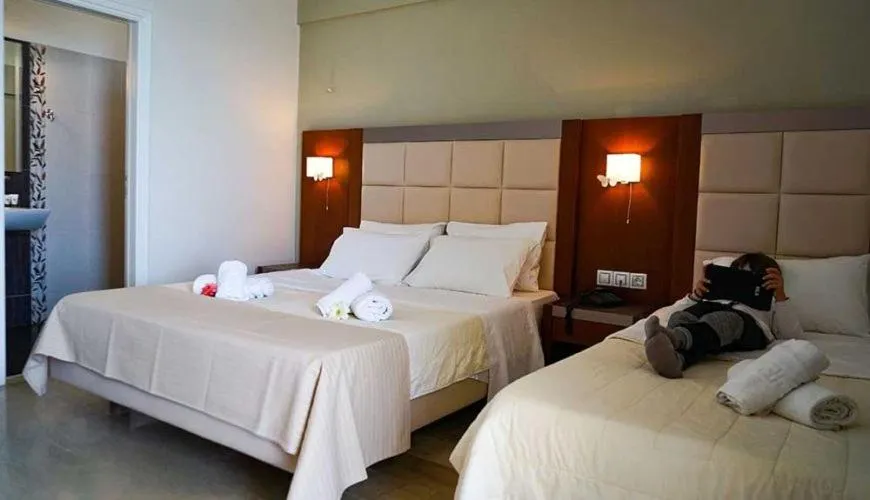 Bed in GOLDEN SUN Κokkoni Beach Hotel