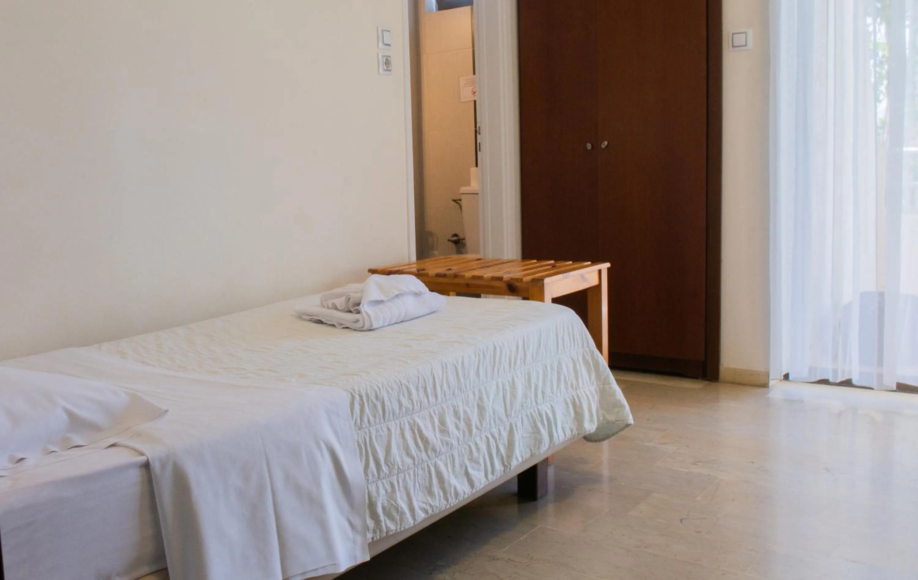 Bed in GOLDEN SUN Κokkoni Beach Hotel