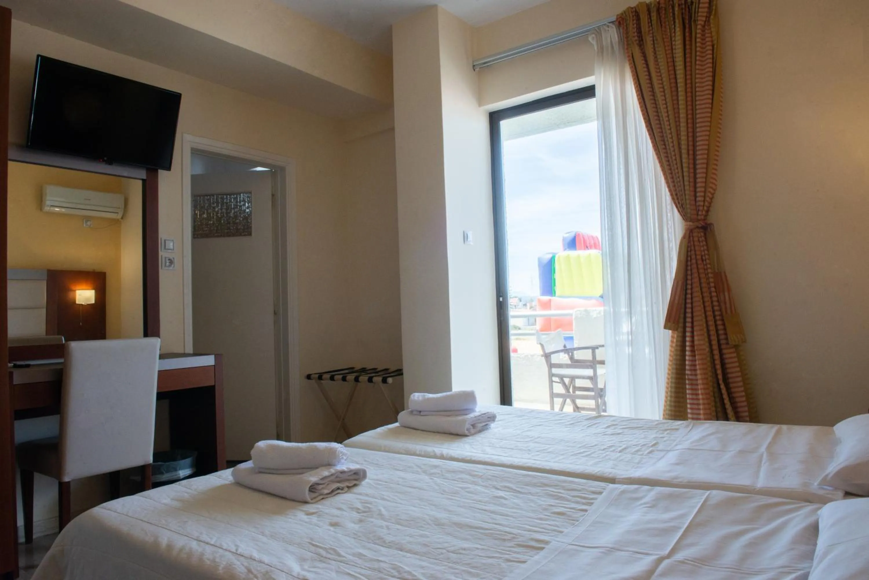 Bed in GOLDEN SUN Κokkoni Beach Hotel