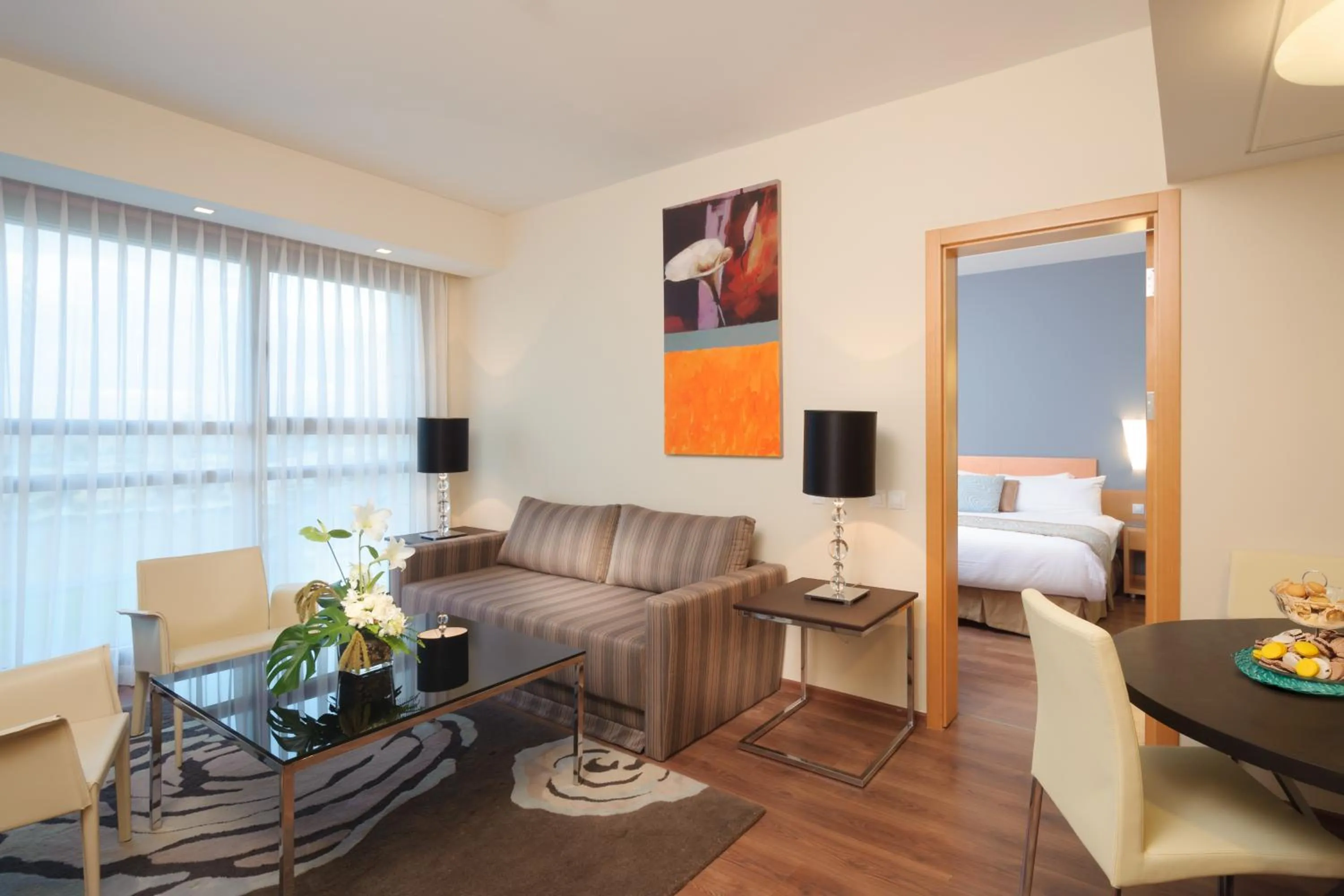 Seating area, Bed in Leonardo Plaza Ashdod