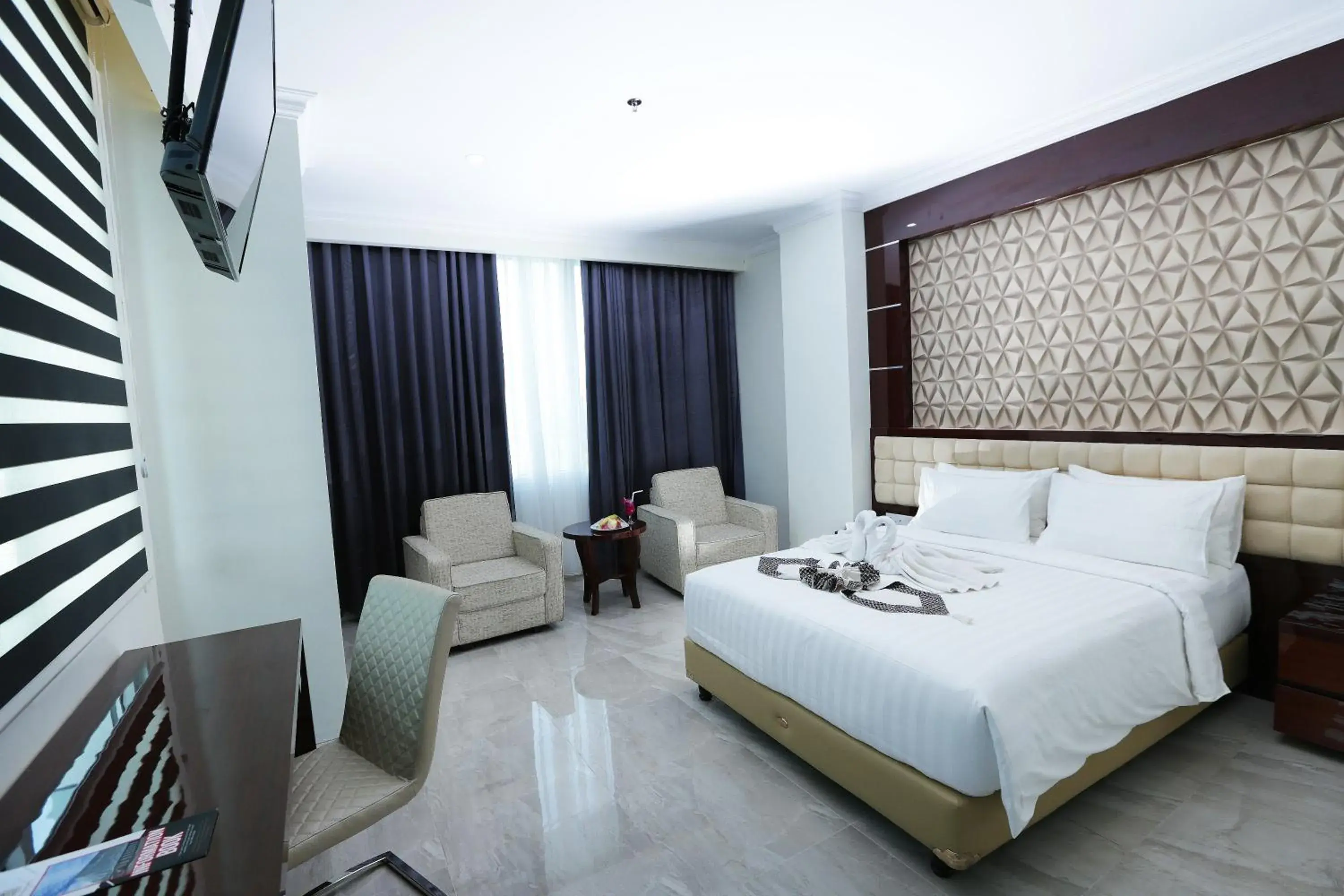 Bedroom in Sindoro Hotel Cilacap By Conary Bedroom in Sindoro Hotel Cilacap By Conary