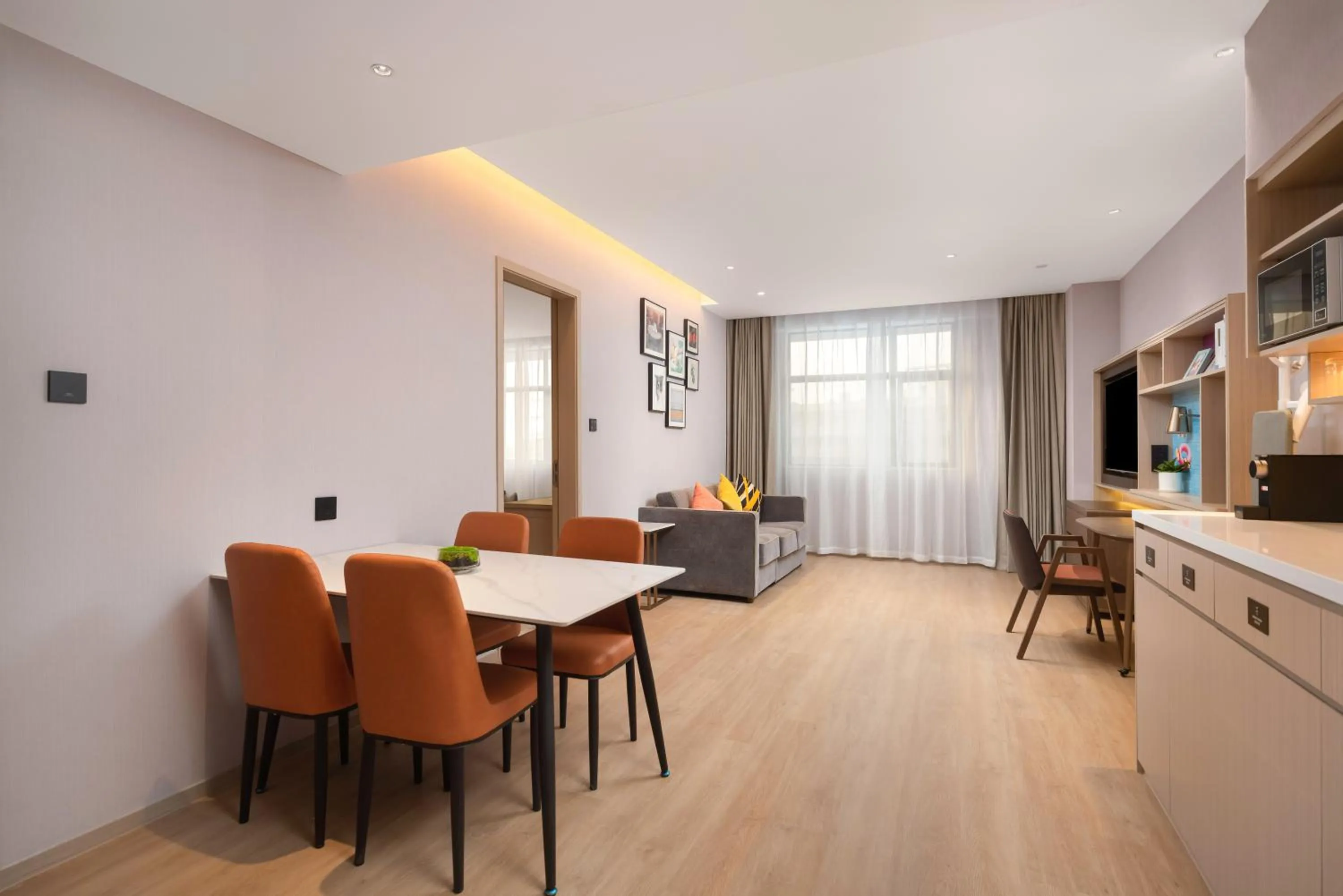 Living room in Home2 Suite by Hilton Dongguan Shijie