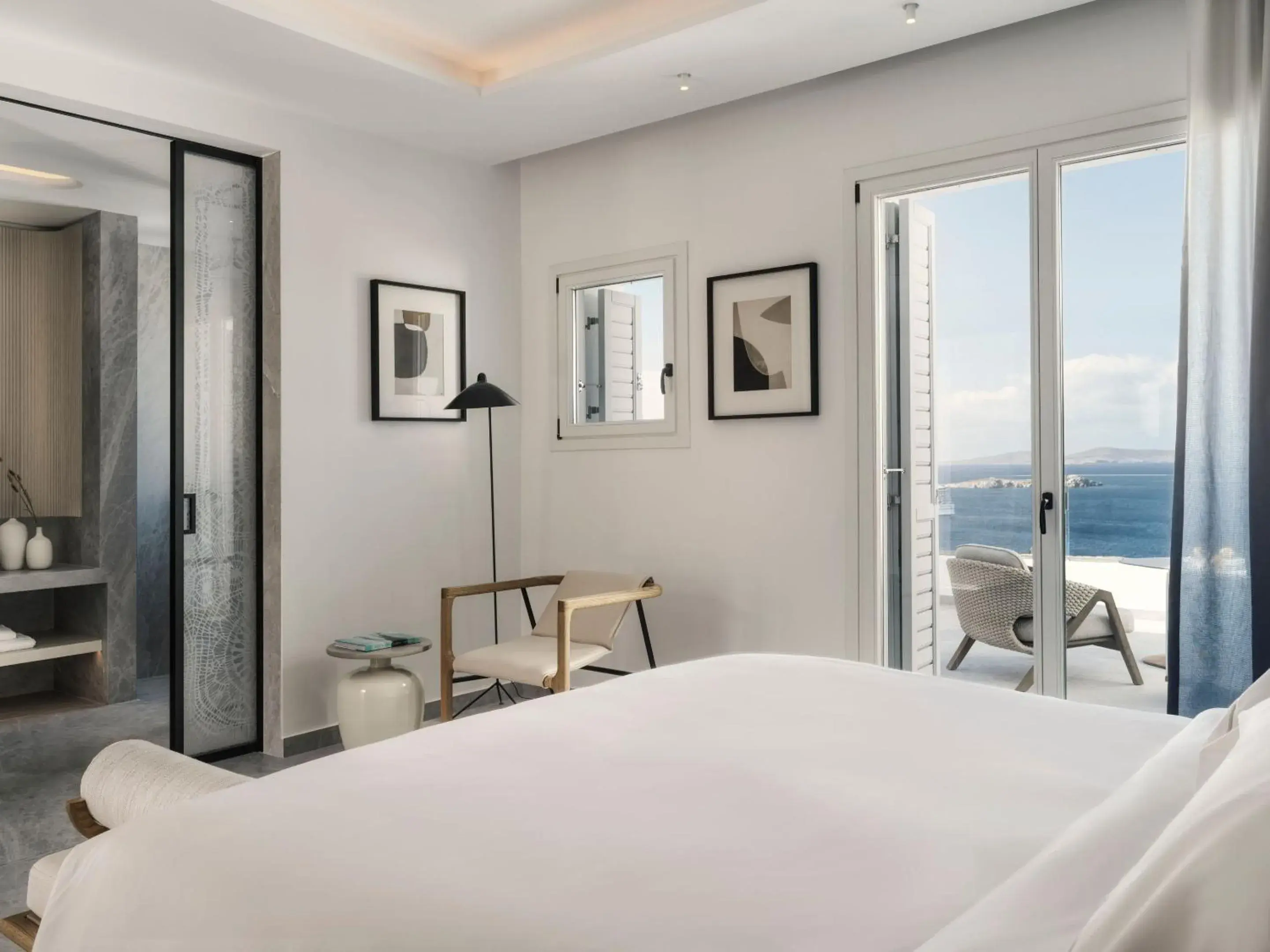 Balcony/Terrace, Bed in Deos Mykonos - A Myconian Collection Hotel Balcony/Terrace, Bed in Deos Mykonos - A Myconian Collection Hotel