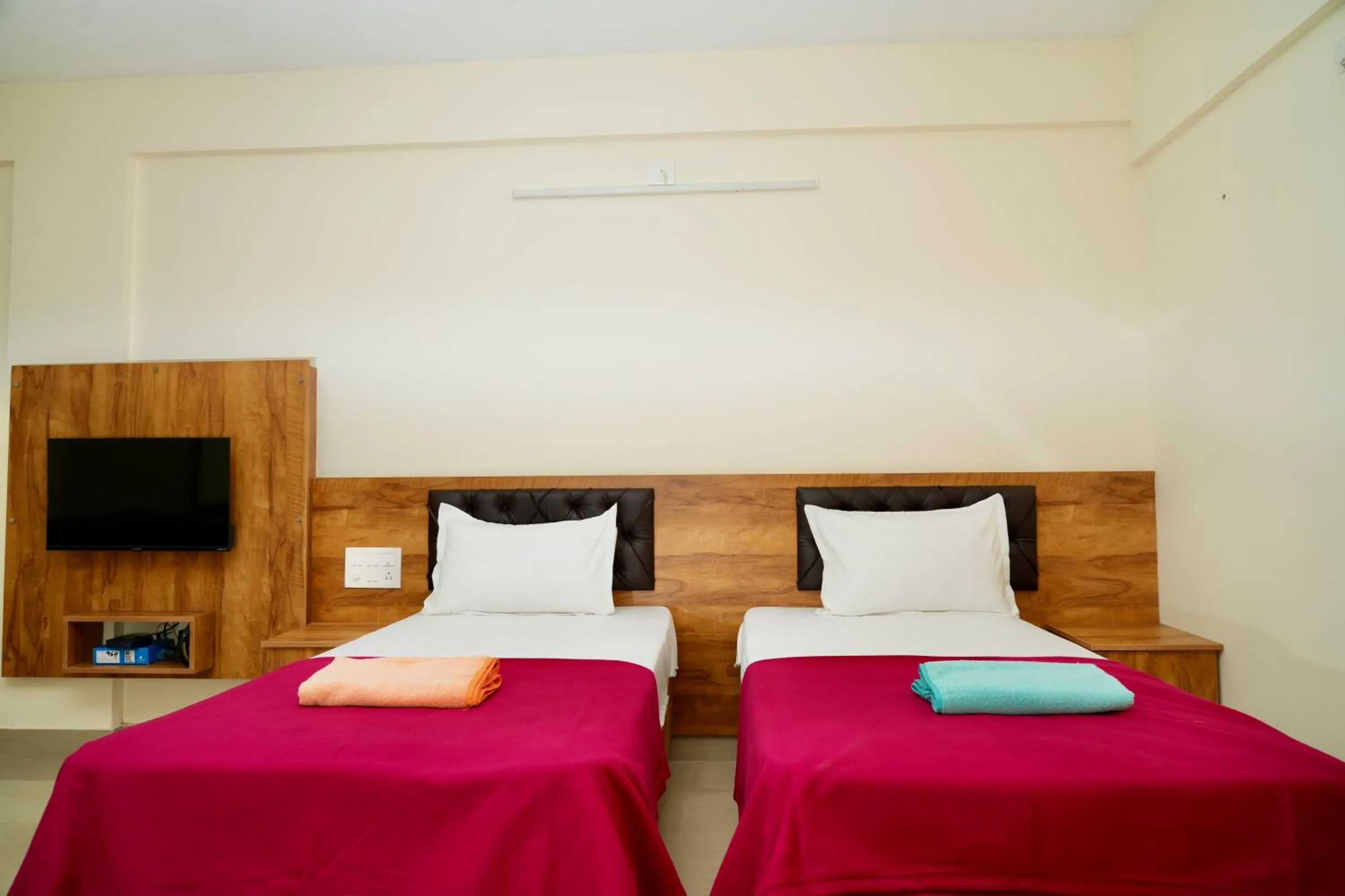 Photo of the whole room, Bed in Shree Swarna Comforts