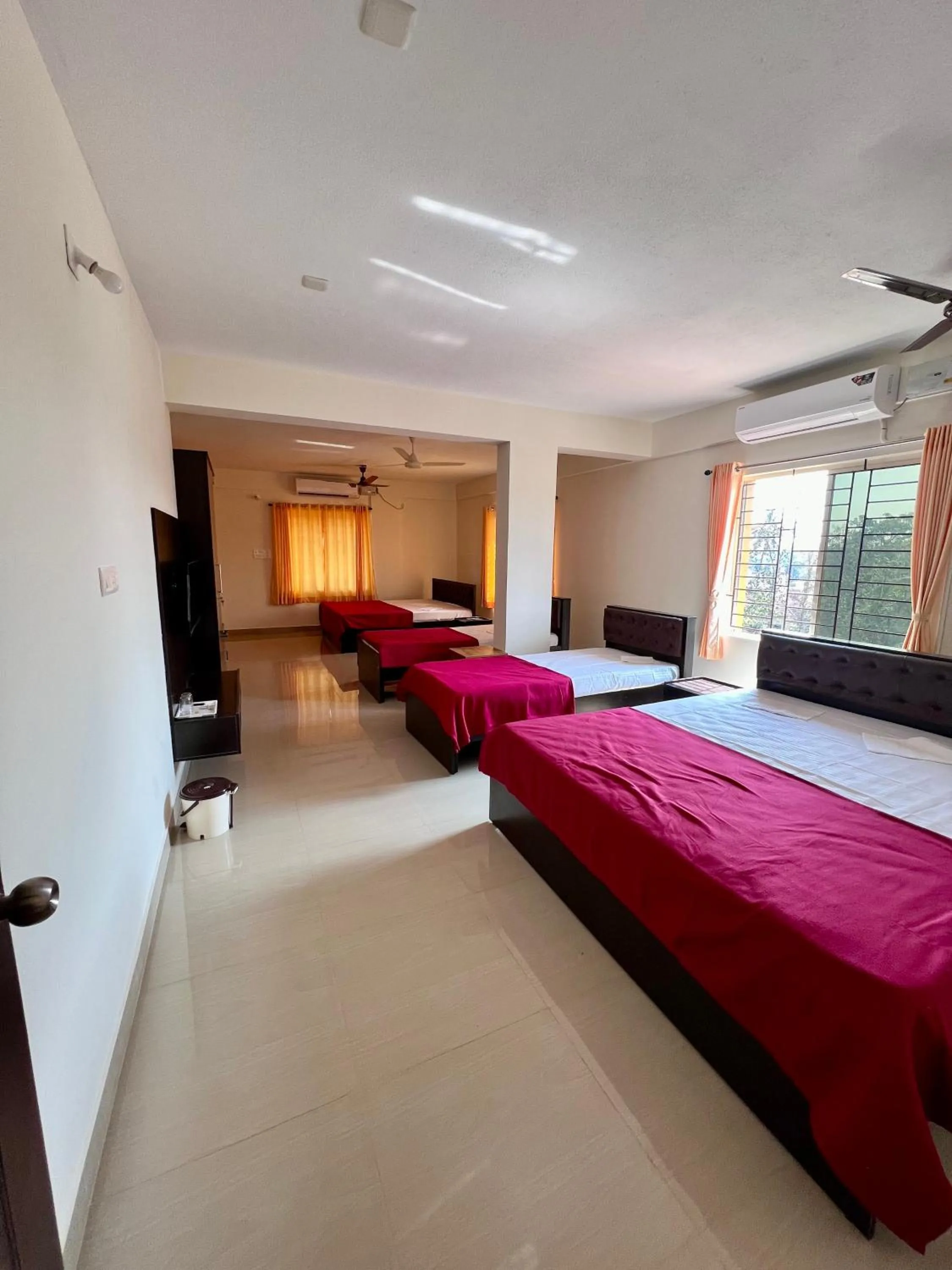 Photo of the whole room, Bed in Shree Swarna Comforts