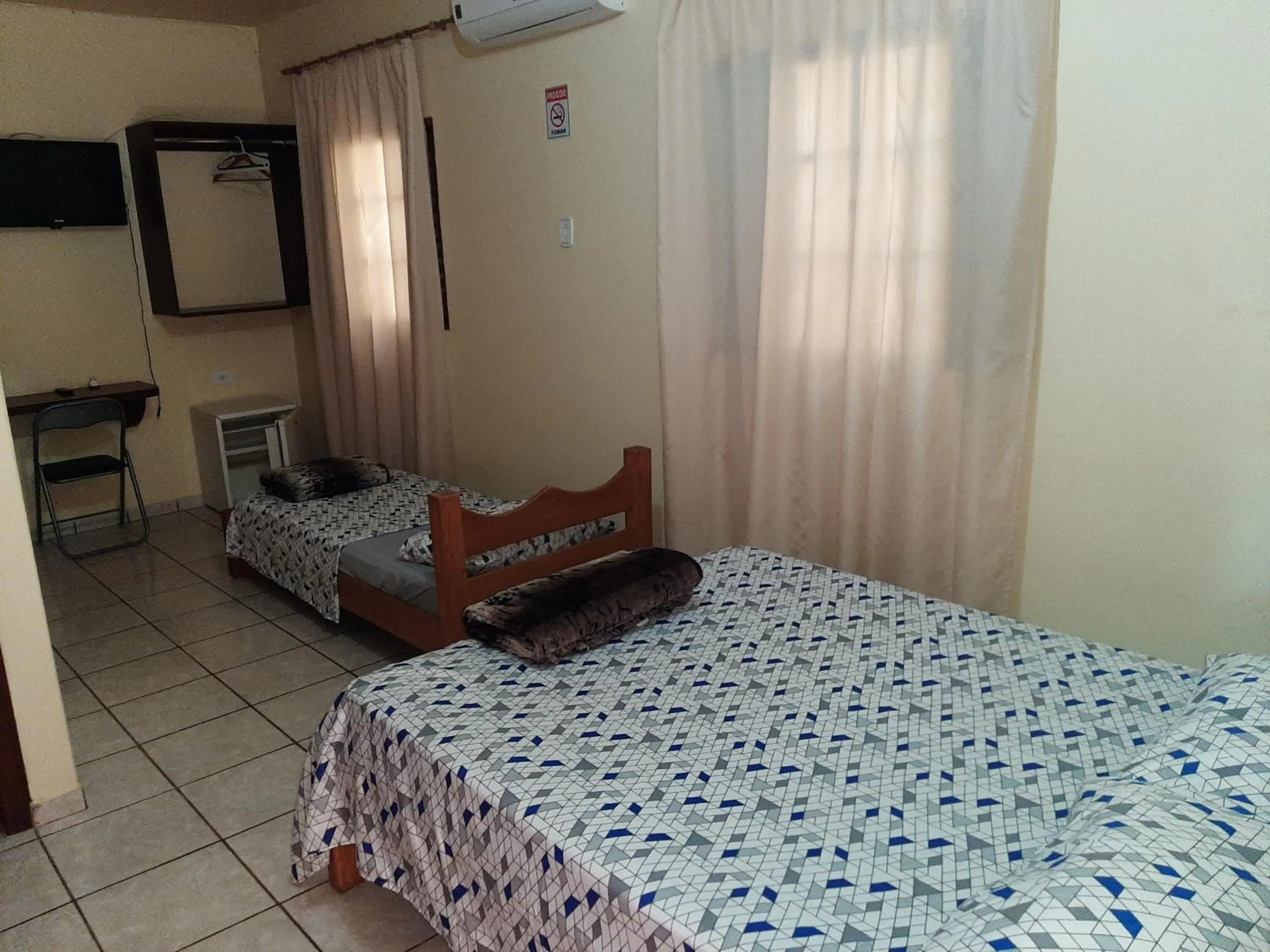 Bed in Pousada Paraiso