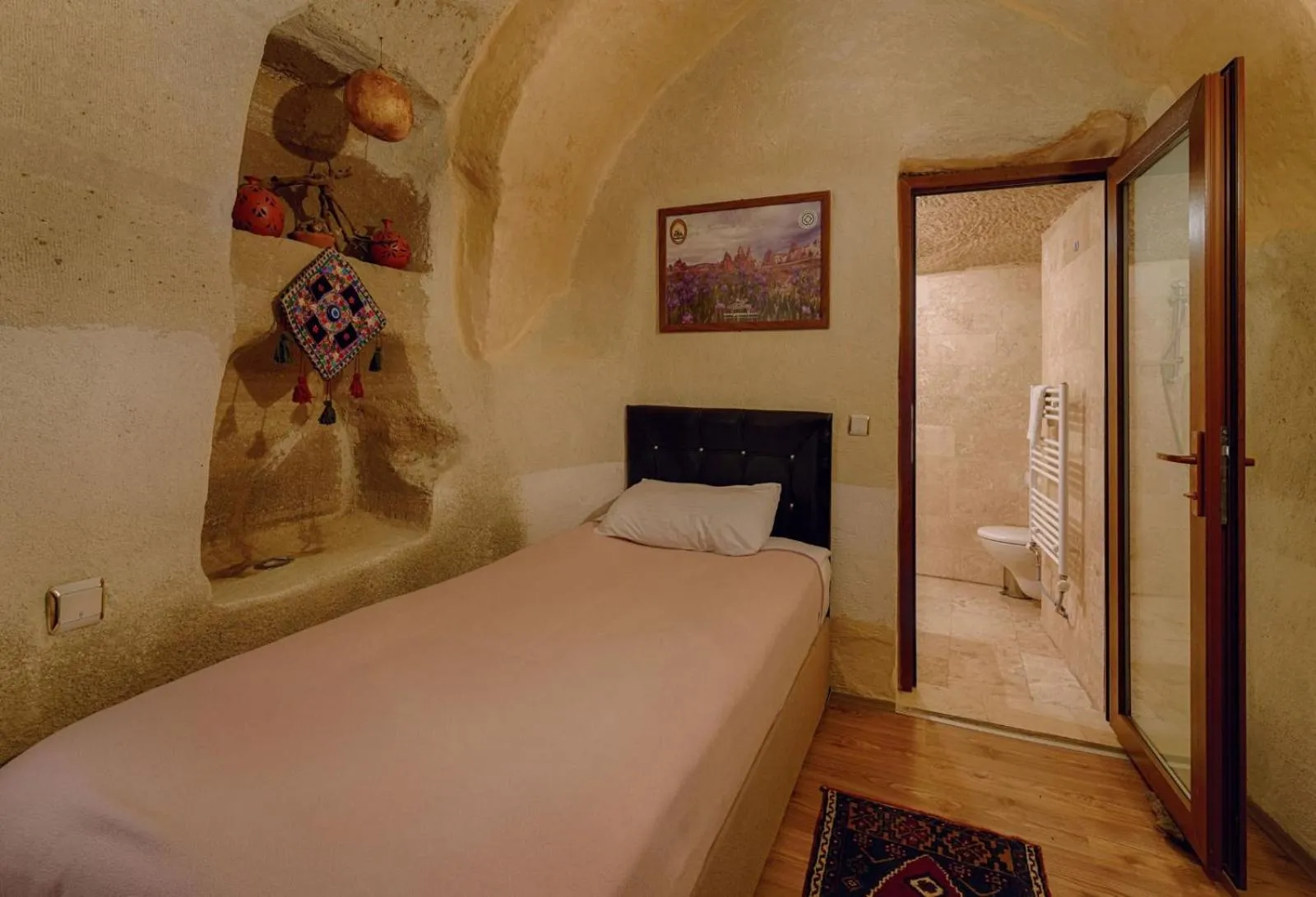 Bed in Avlu Cave House
