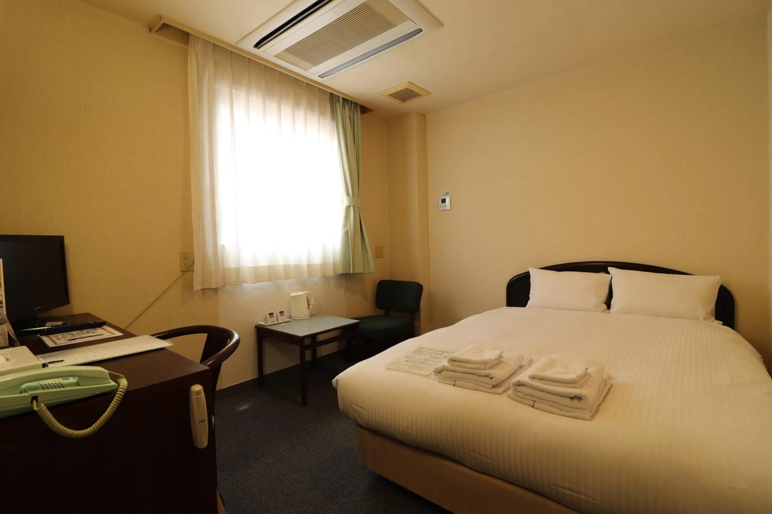 Bed in Hotel Green Arbor