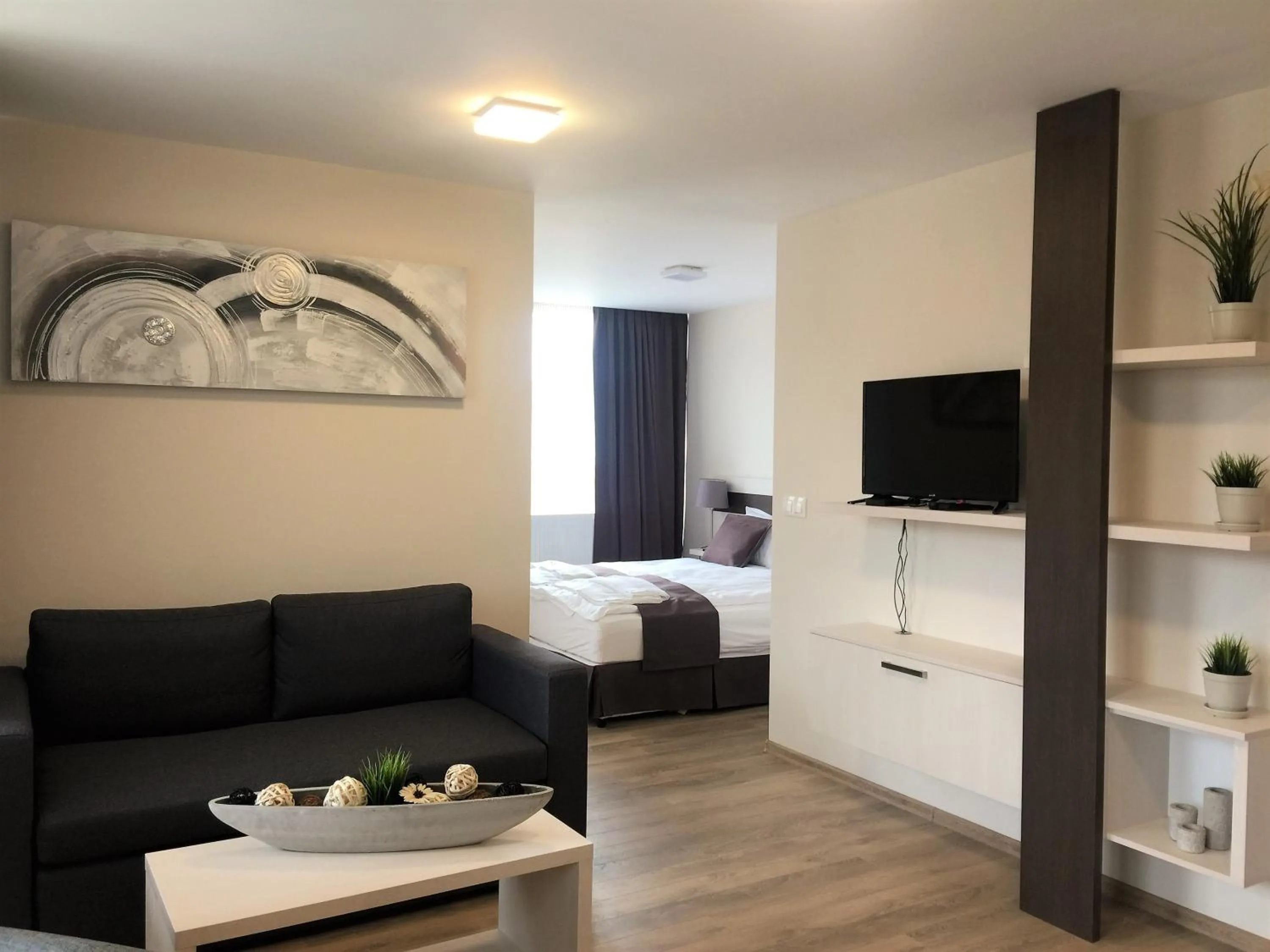 Living room, Bed in Sky Apartments