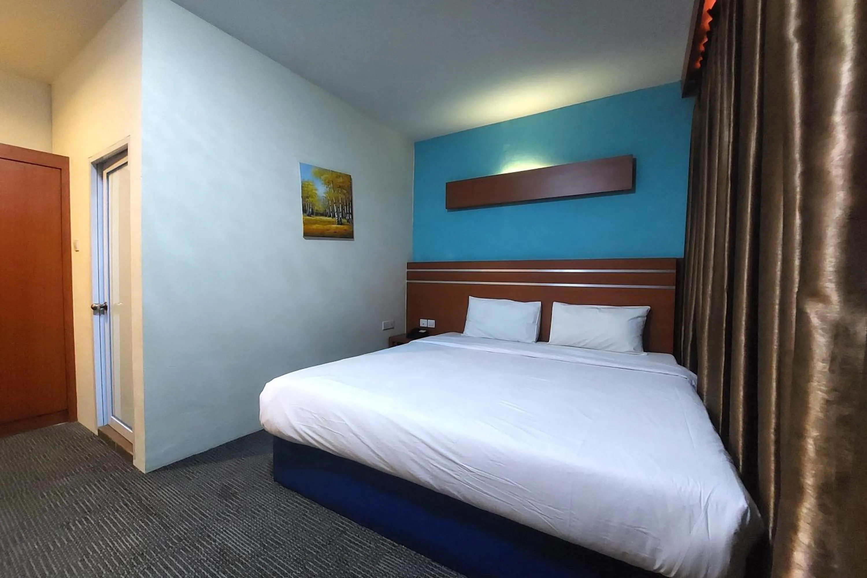 Bed in D'MERLION HOTEL