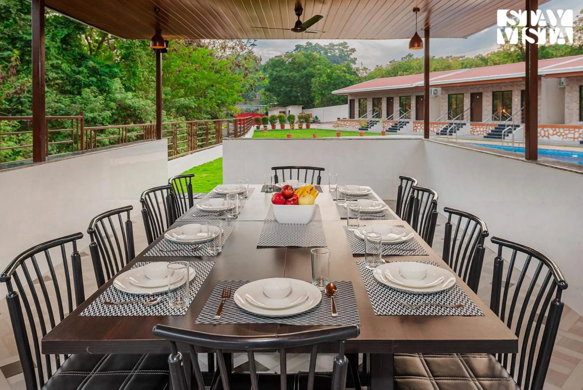 Dining area in Mango Splash by VEO - Part of StayVista