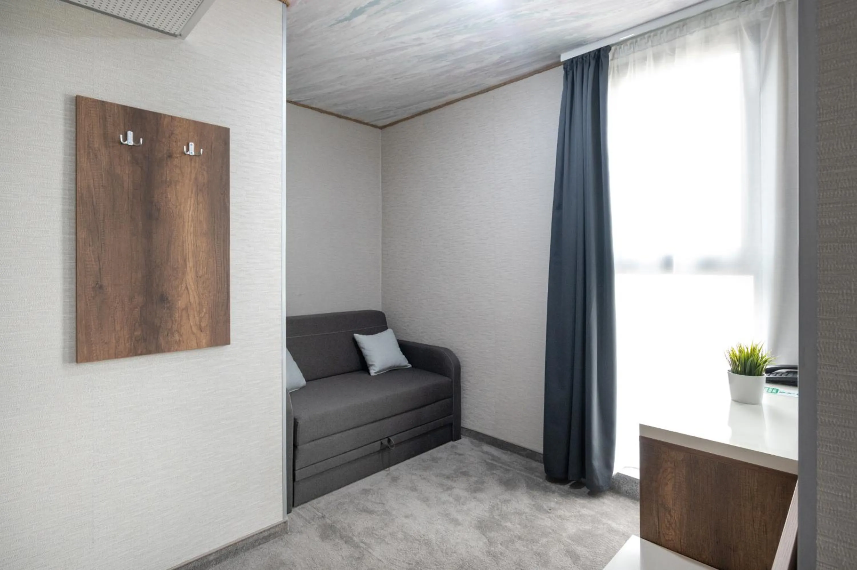 Living room in Hotel Boutique 5 - Free parking - Free breakfast - Free internet - EVSE