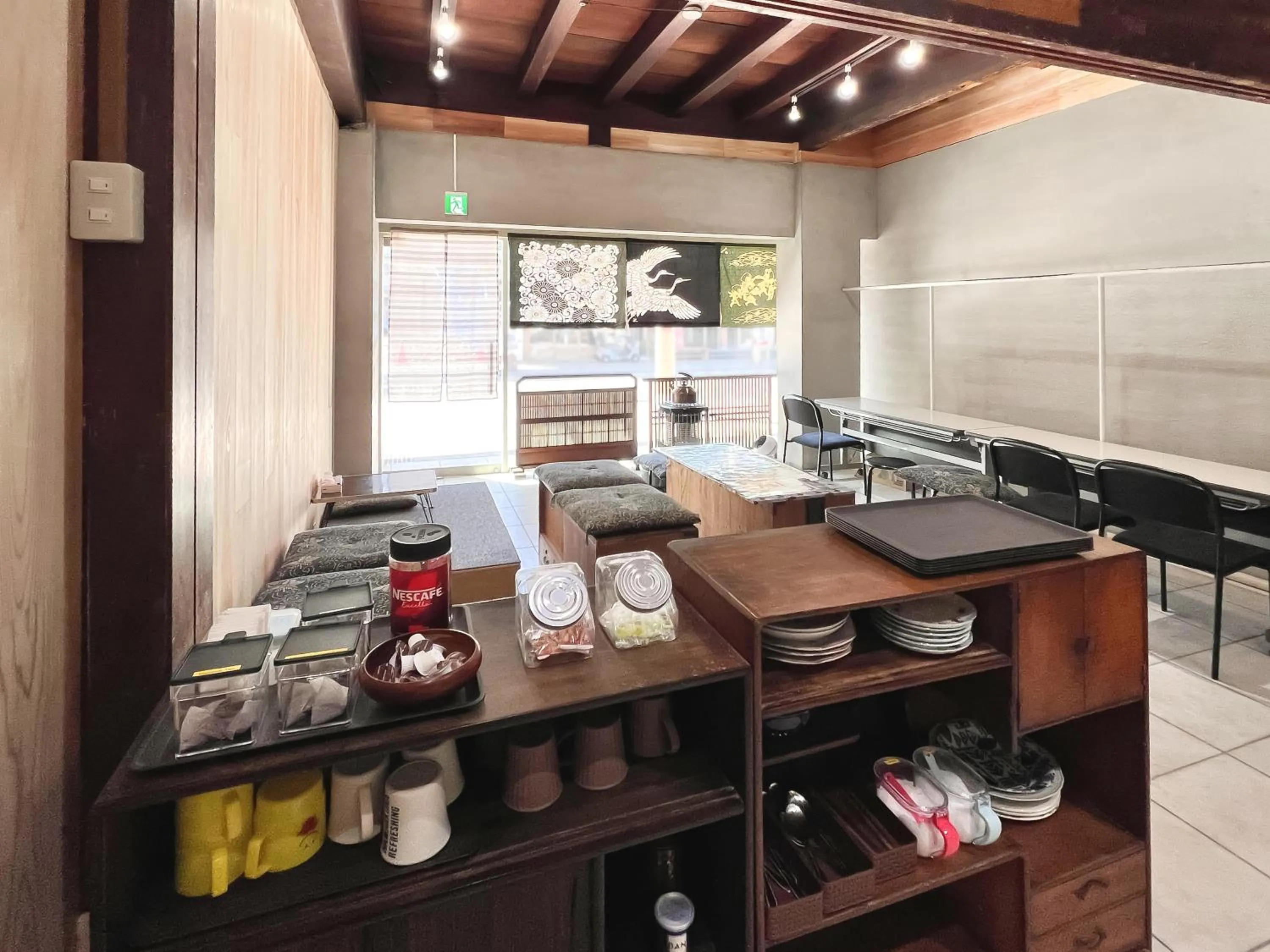 Communal lounge/ TV room in Hostel Miyagawa by Murasaki