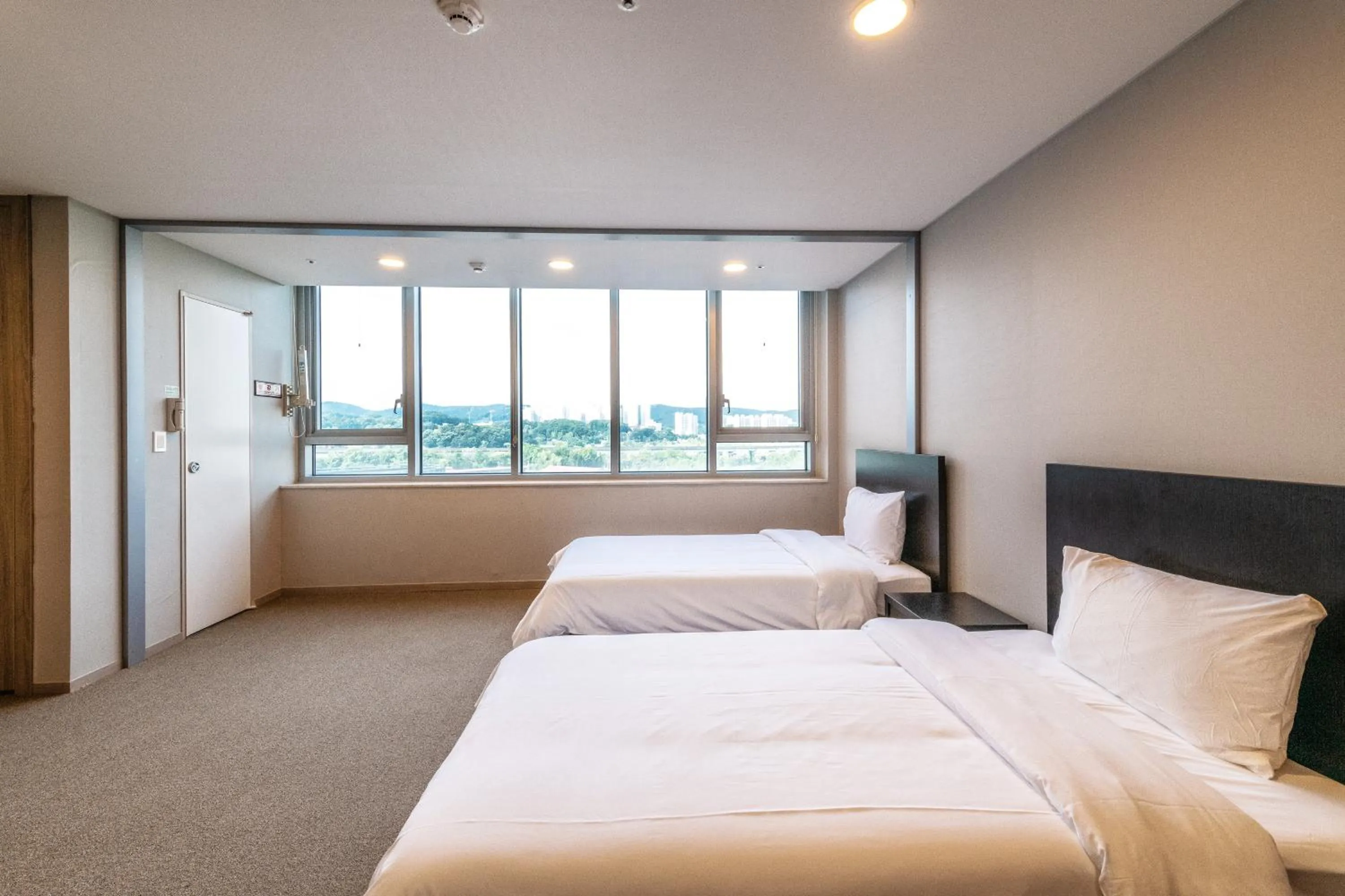 Bed in The Triny Urban Suites