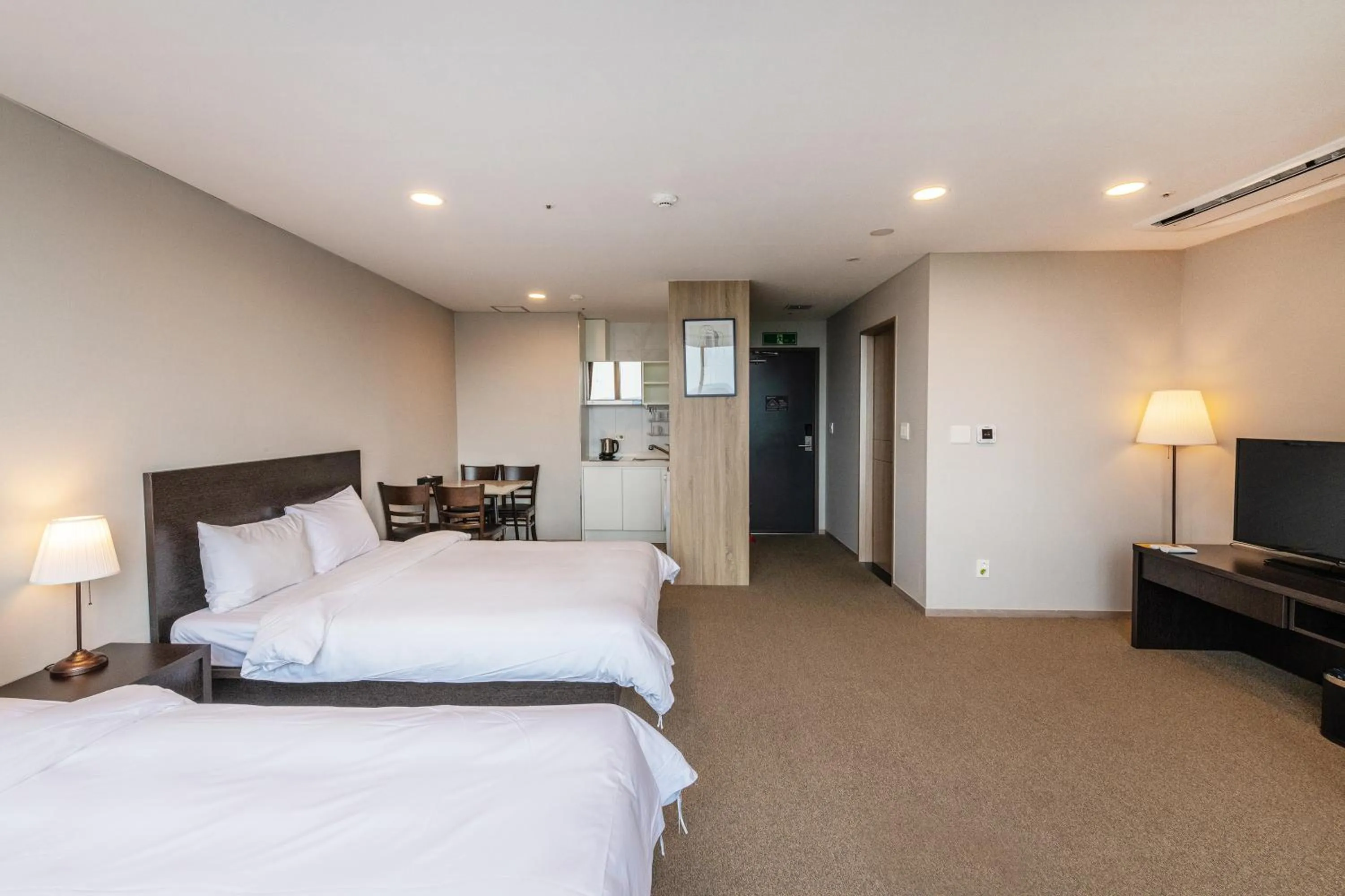 Bed in The Triny Urban Suites