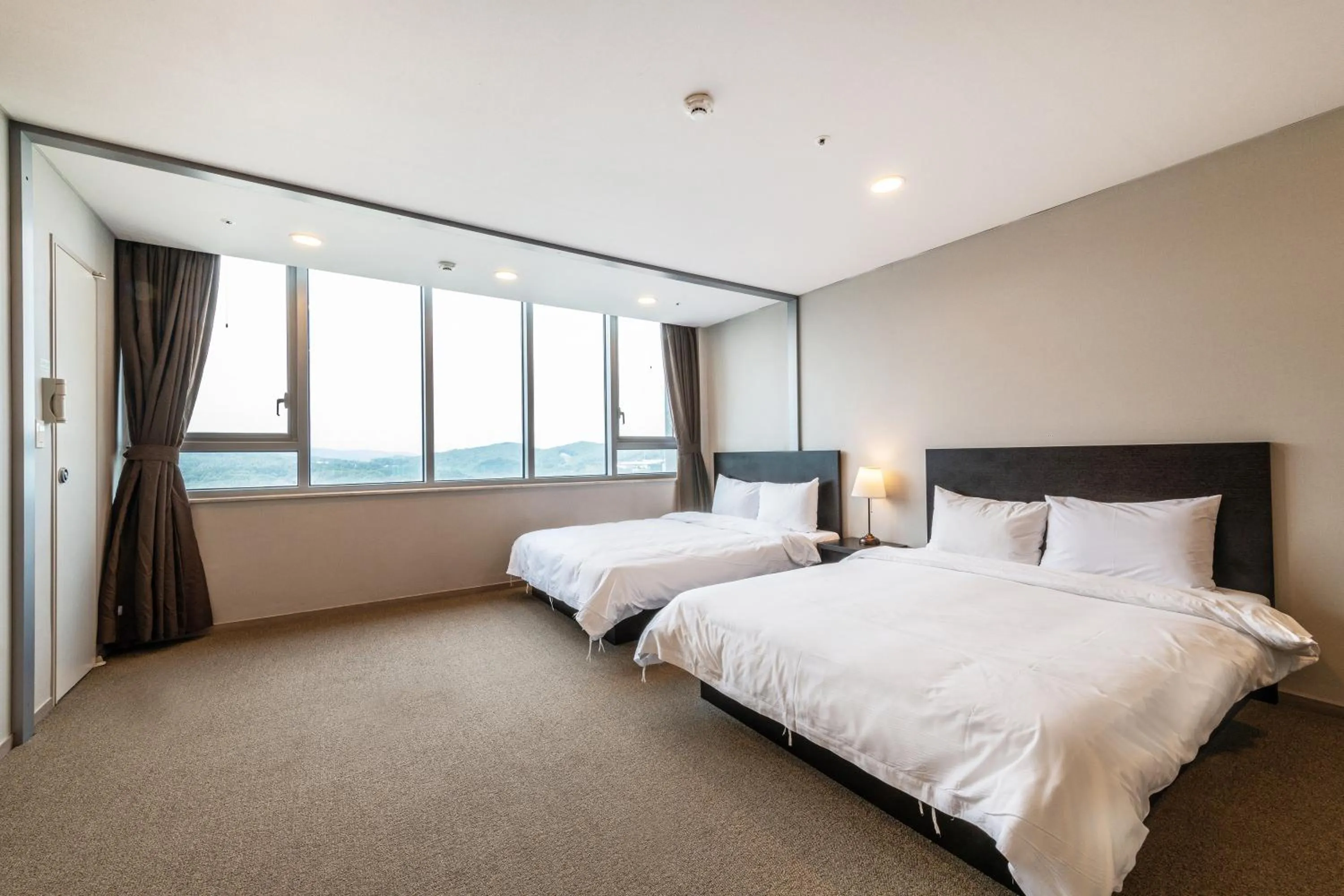 Bed in The Triny Urban Suites