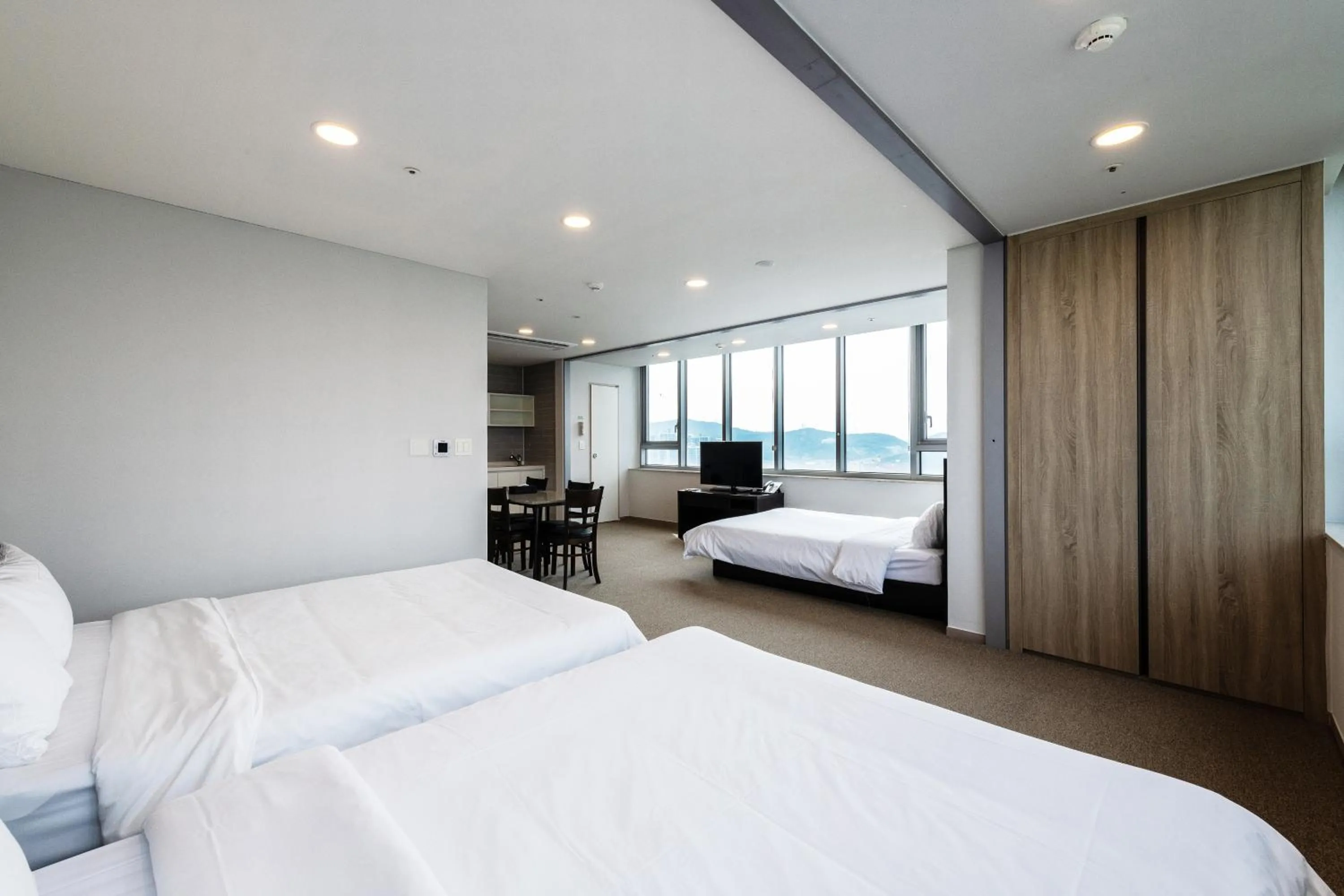 Bed in The Triny Urban Suites