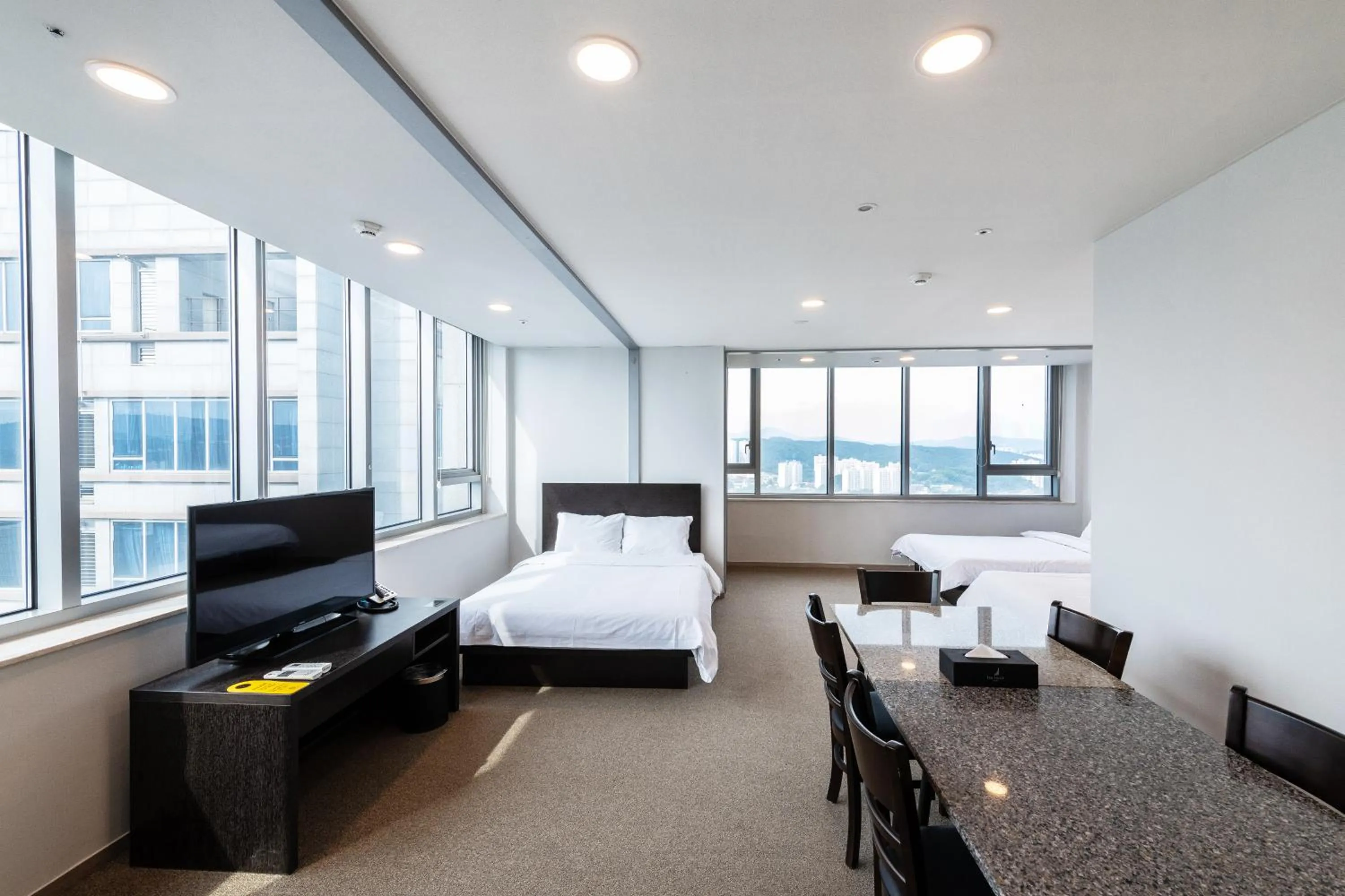 Bed in The Triny Urban Suites