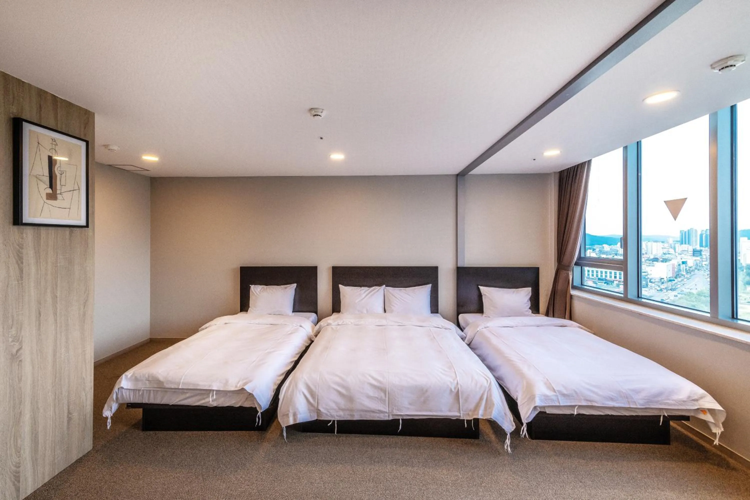 Bed in The Triny Urban Suites