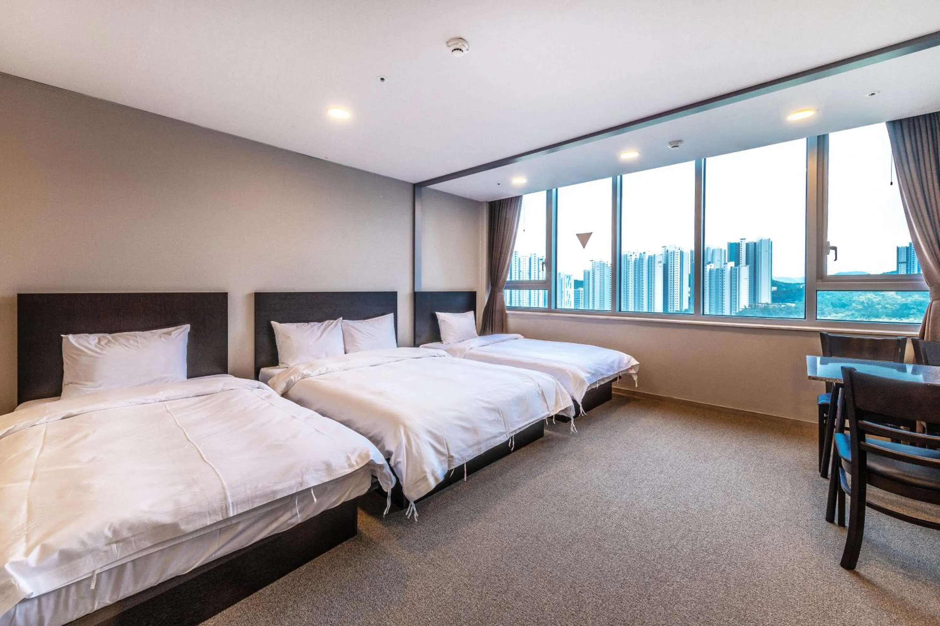 Bed in The Triny Urban Suites