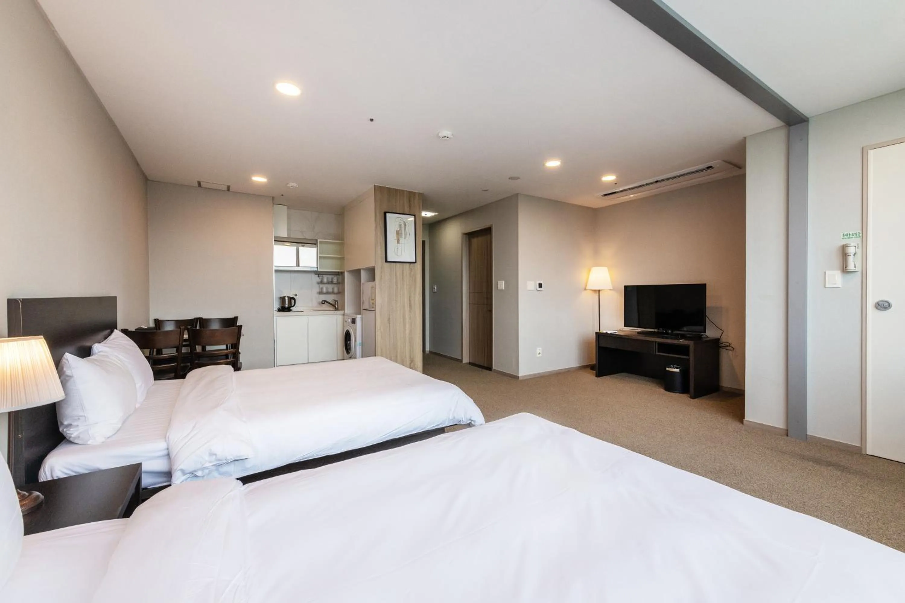 Bed in The Triny Urban Suites