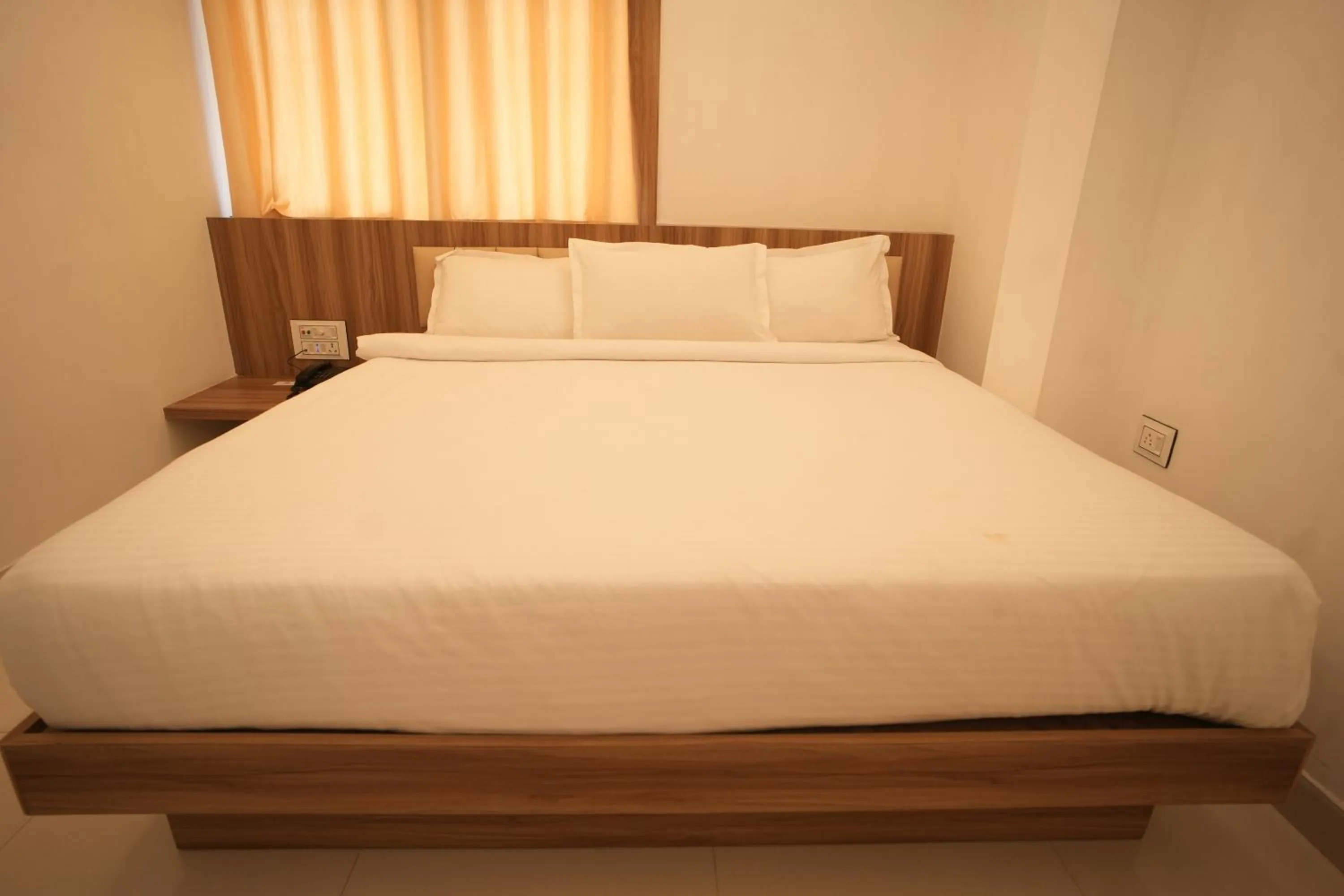 Bed in Hotel Shanti International